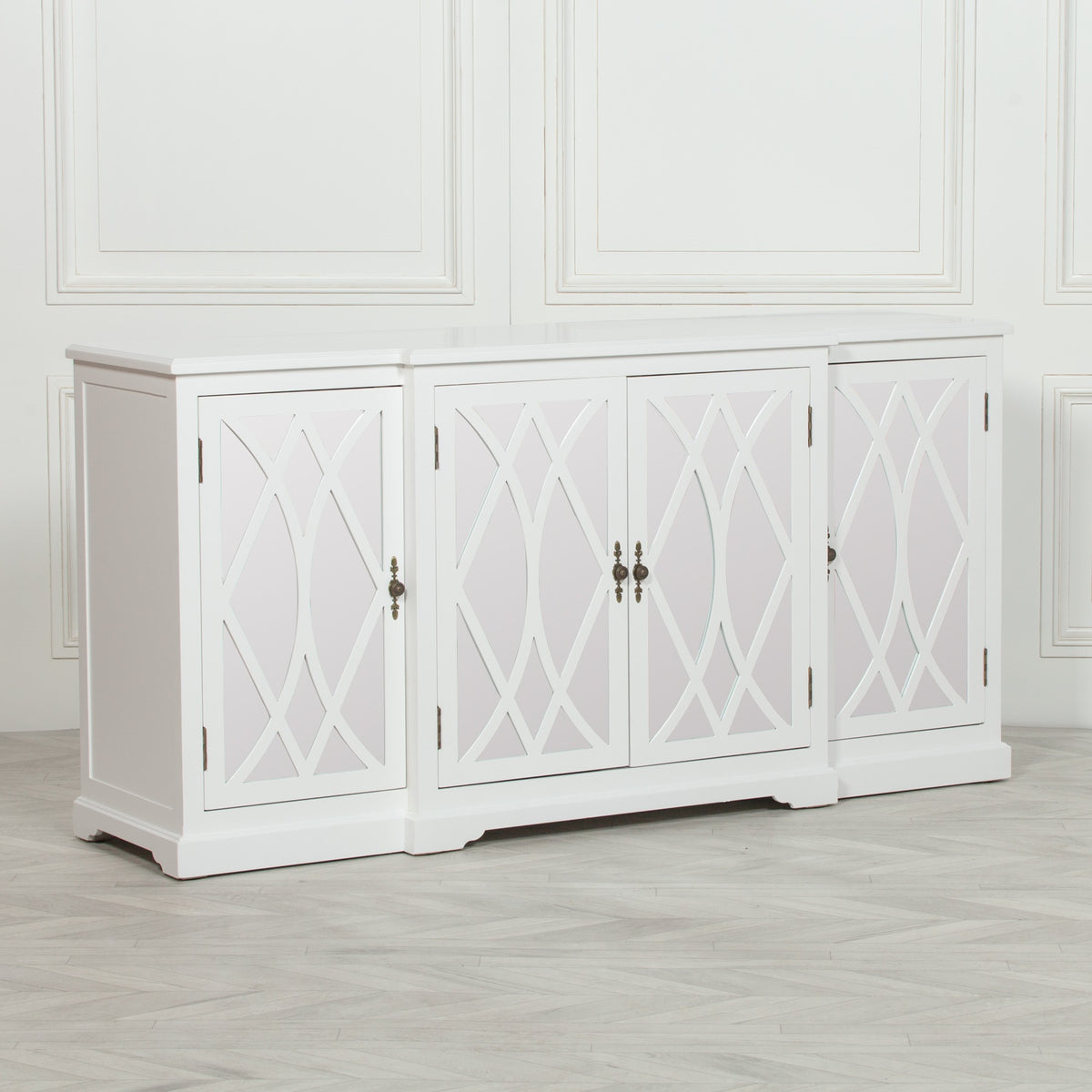 Angled view of the Anaïs White Mirrored Four Door Breakfront Sideboard featuring mirrored lattice glass doors, crisp white painted finish, breakfront design and generous storage for elegant living room or dining room interiors.