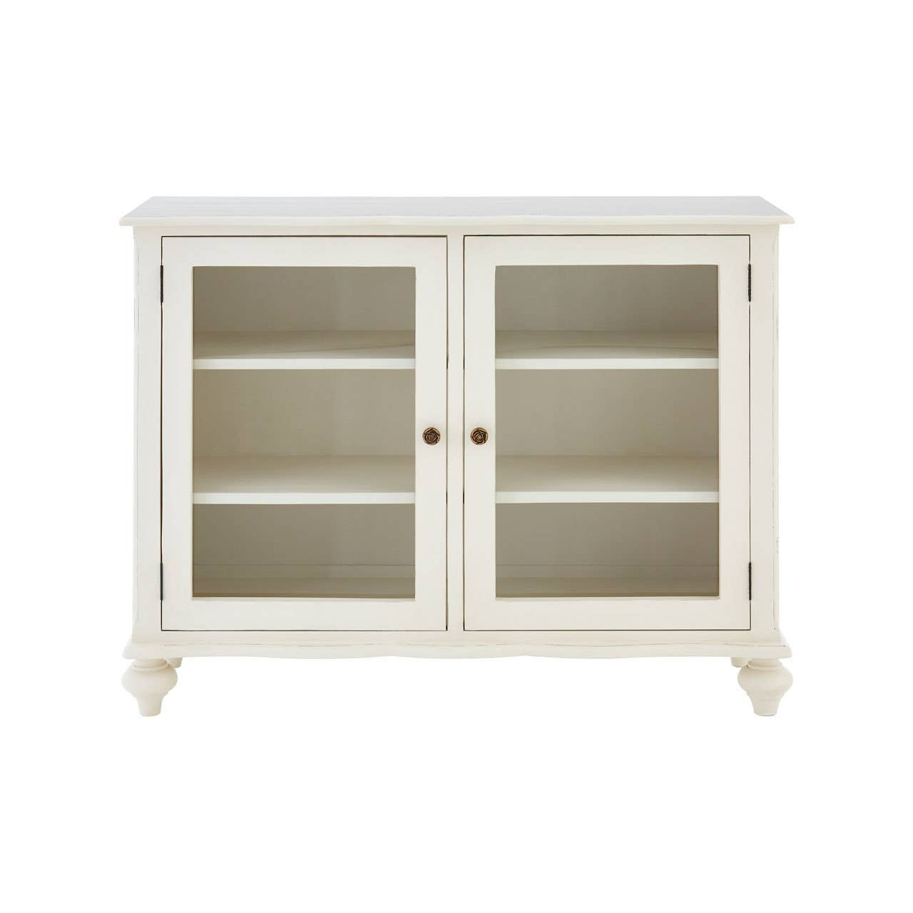 Front view of the Camille White Display Cabinet with glass doors and carved detailing, featuring a timeless painted white finish, spacious internal shelving, decorative bronze-effect knobs and elegant storage for dining rooms, living rooms and French country interiors.