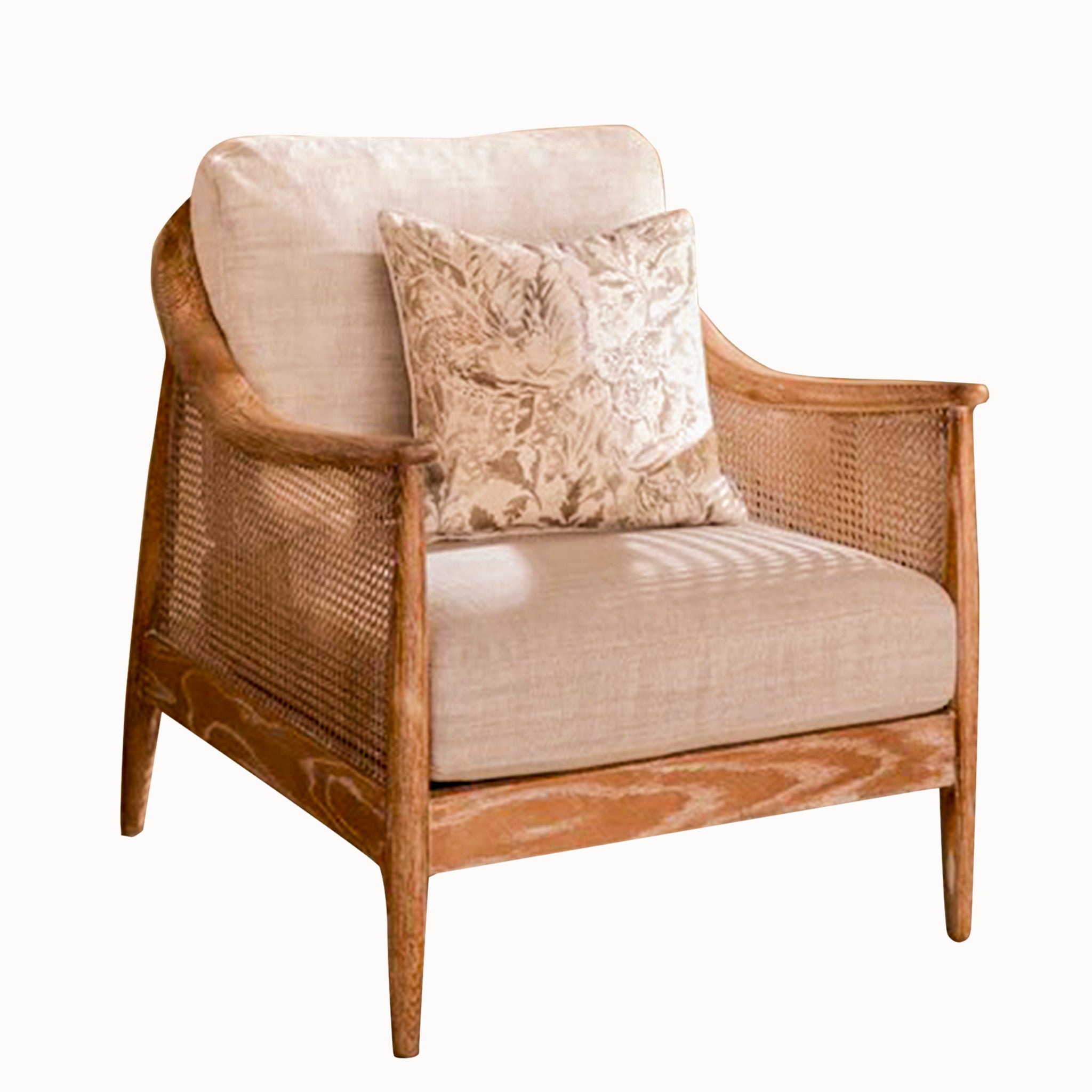 Elara French Style Rattan Accent Chair with Linen Seat on a white background showcasing the natural oak frame, woven cane panels, linen seat cushion and decorative floral scatter cushion.