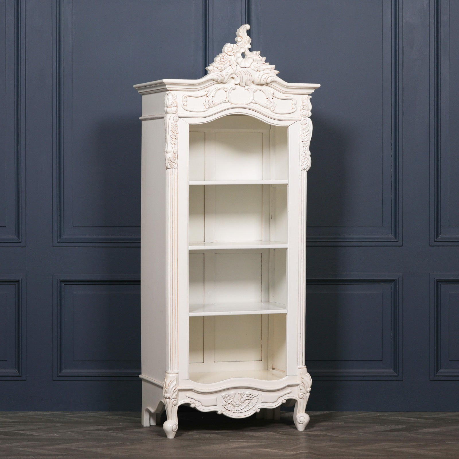 Front view of the Rosalie Tall French Open Bookcase handcrafted from mahogany wood in an Antique White finish, featuring ornate Rococo hand-carved detailing, adjustable open shelving and elegant French provincial styling for luxury living rooms, bedrooms and home libraries.