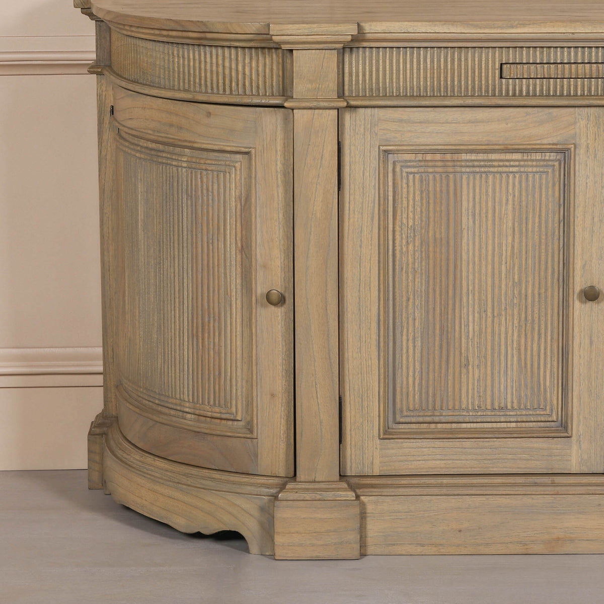 Close-up of the Théodore Rustic Fluted Buffet Sideboard showing hand-carved white cedar wood, fluted panel detailing, curved cabinet end, solid wood construction and artisan craftsmanship.