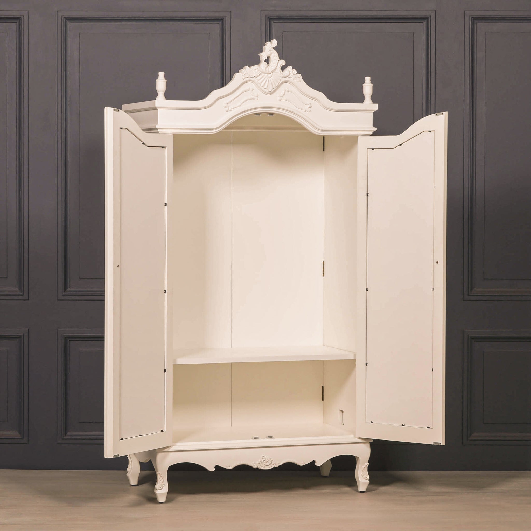 Mirrored armoire wardrobe with doors open showing hanging rail and internal storage