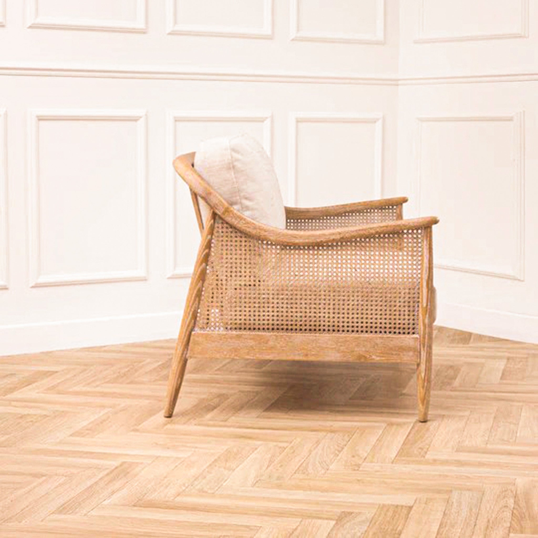 Elara Rattan Accent Chair – Linen Upholstered Seat