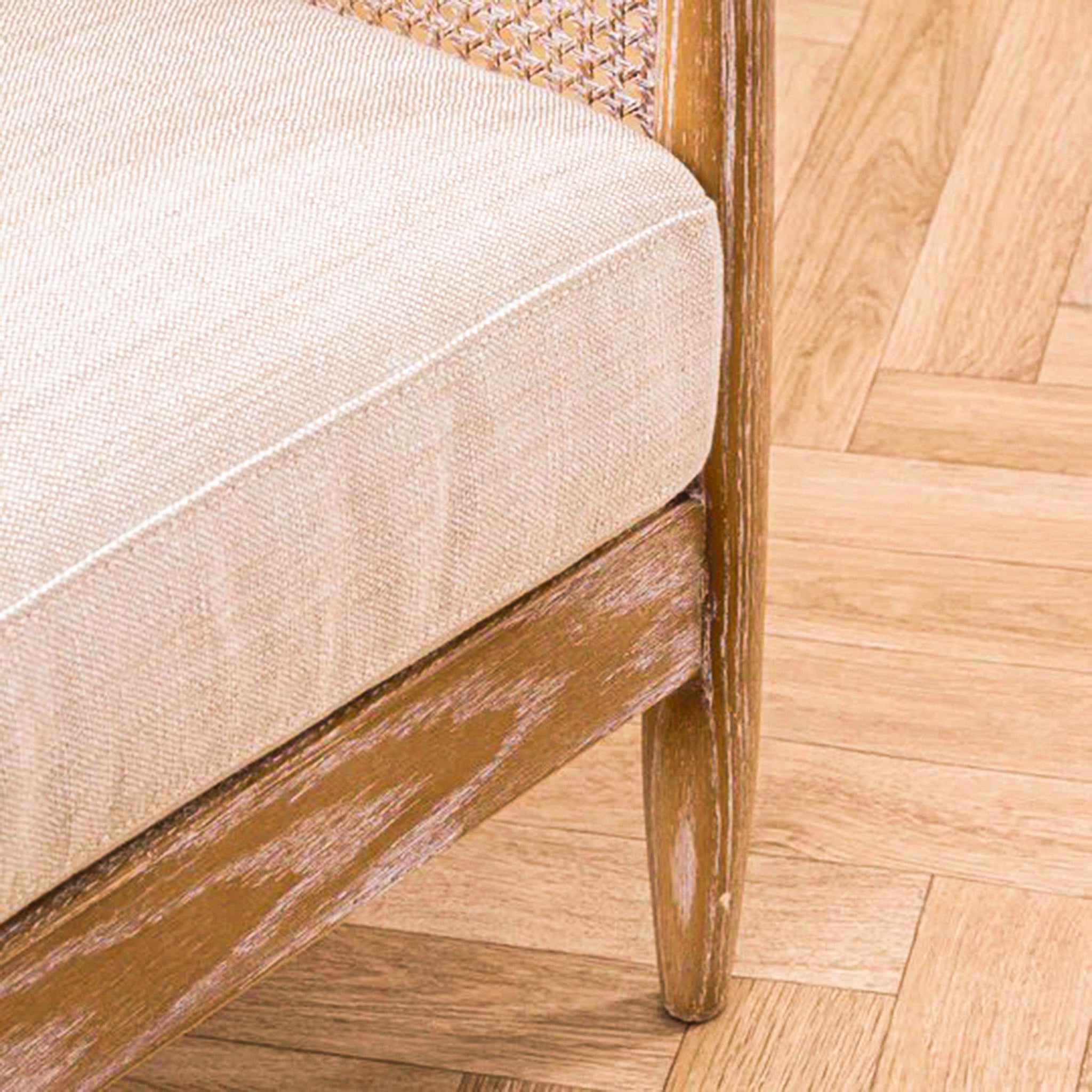 Elara Rattan Accent Chair – Linen Upholstered Seat