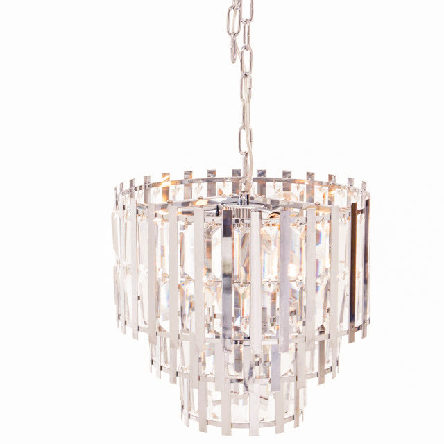 Angled view of the Adrien Chrome Crystal 8 Light Chandelier showcasing the polished chrome frame, faceted crystal prisms and layered tiered silhouette that reflects light beautifully in contemporary luxury interiors.