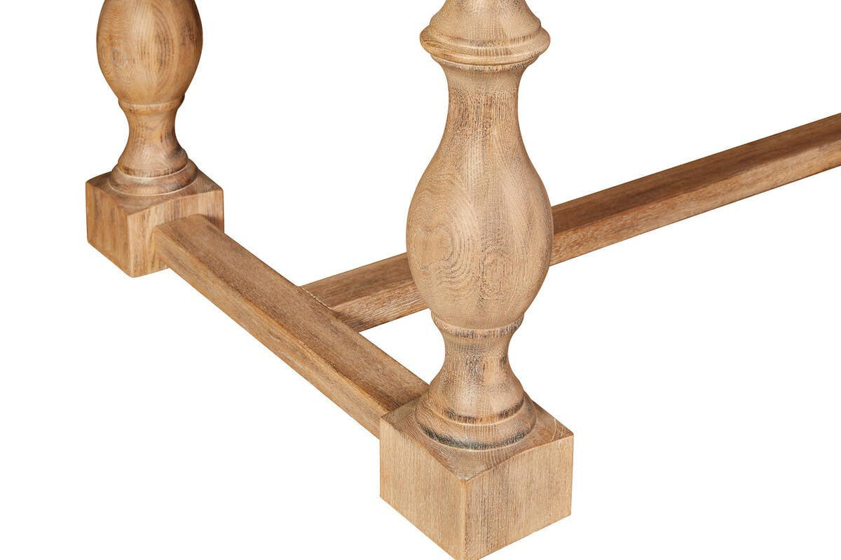 Close-up of the Alaric Large Rectangular Dining Table 220cm featuring handcrafted turned baluster legs, solid Washed Oak Wood construction, trestle stretcher base and traditional woodworking details that define this luxury dining table.