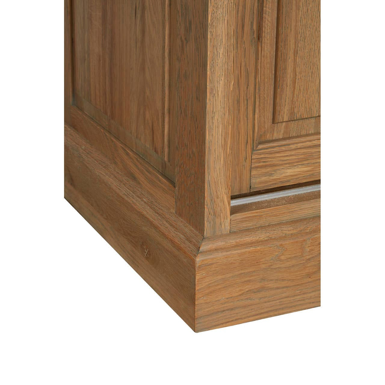 Detailed view of the Alaric Tall Oak Wood Display Cabinet with Sliding Glass Doors & Lower Cupboards showcasing the solid oak plinth base, recessed panel detailing and handcrafted joinery.