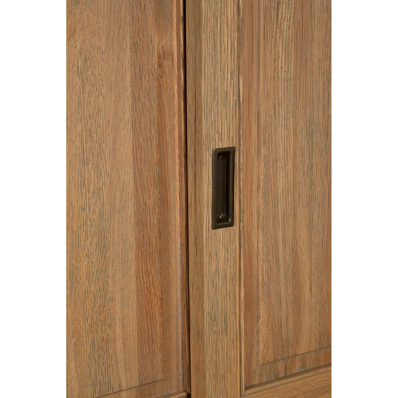 Close-up of the Alaric Tall Oak Wood Display Cabinet featuring the recessed black metal sliding door handle, natural oak grain and smooth sliding glass door design.