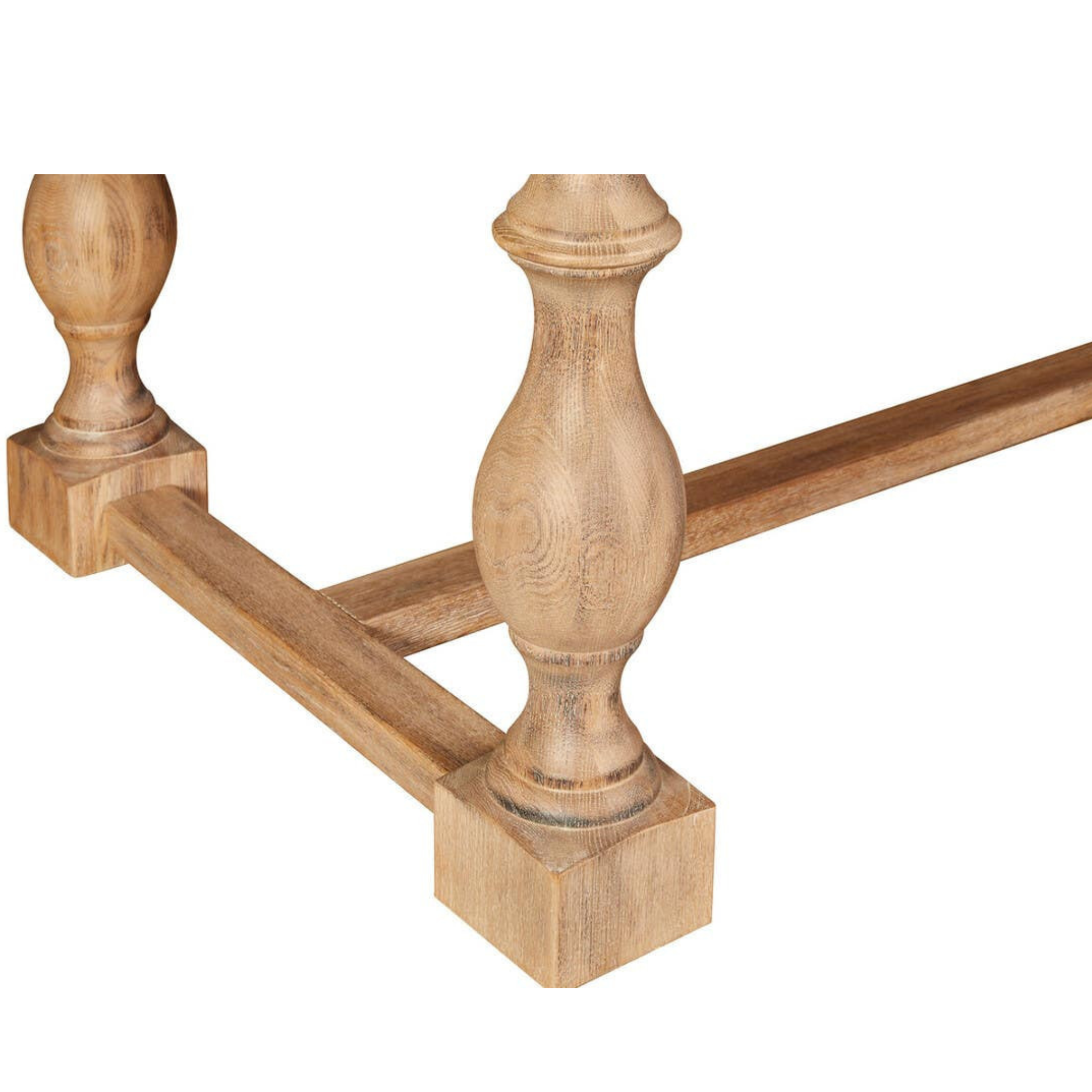 Close-up of Alaric washed oak dining table turned legs and stretcher detailing on a clean white background.