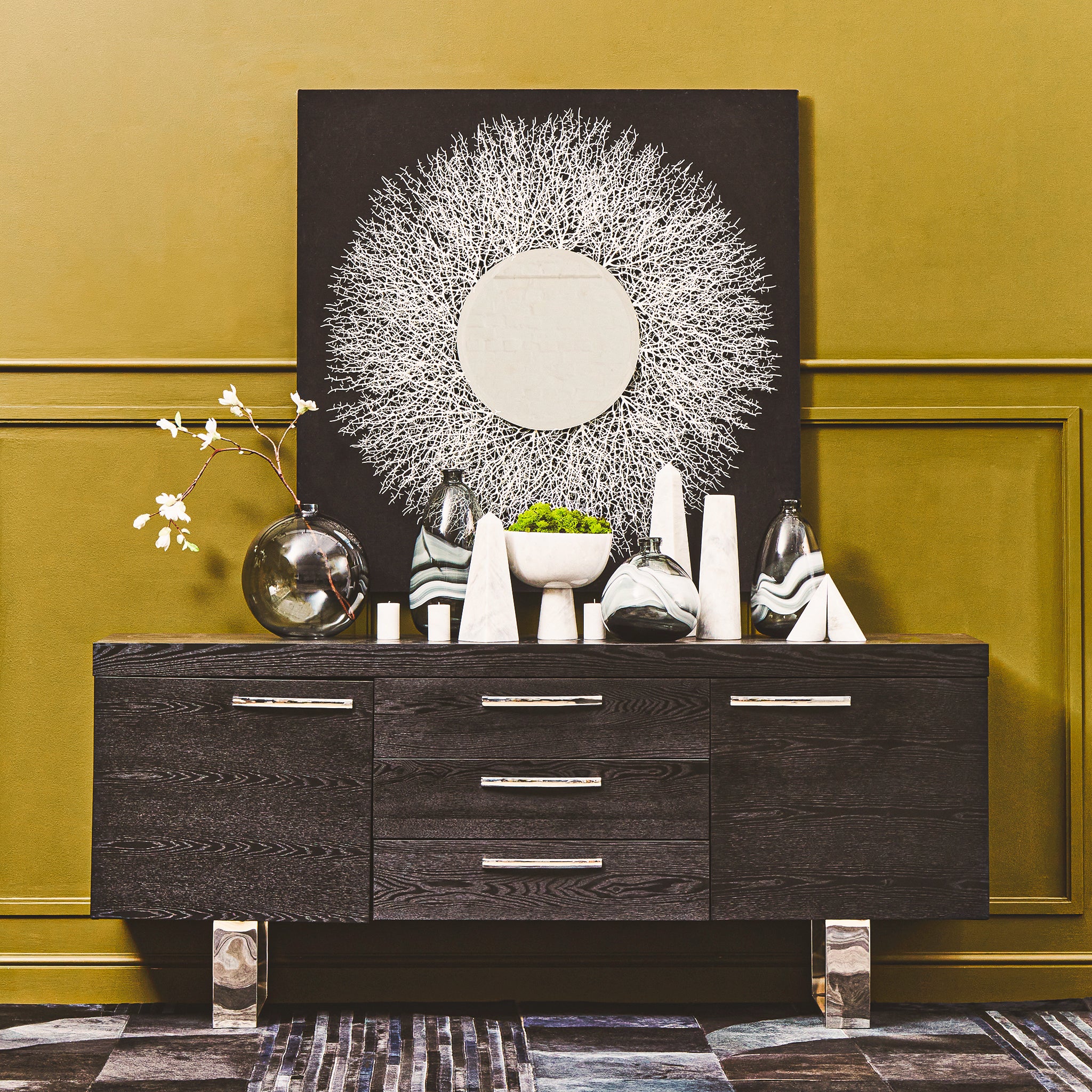 Alix tapered white stone marble vase displayed within a modern luxury interior, adding height and natural texture to a styled sideboard with contemporary decorative objects and premium home décor accessories.