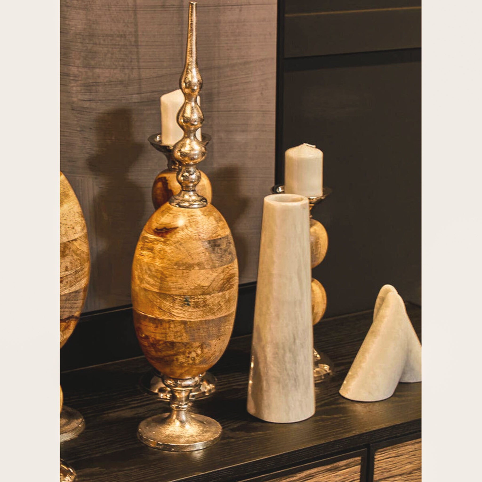 Alix tapered white stone marble vase styled on a contemporary sideboard alongside decorative accessories, demonstrating its elegant sculptural form and versatility as a luxury decorative vase for living rooms, dining rooms and entrance consoles.