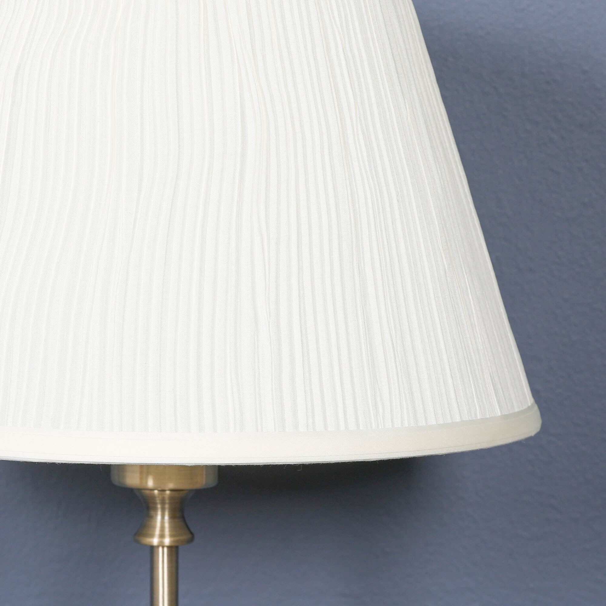 Close-up of the cream pleated fabric lampshade on the Amélie Classical satin brass table lamp highlighting the fine pleated texture and elegant traditional craftsmanship.