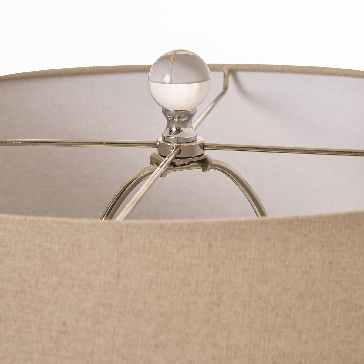 Close-up of the Amélie Grey Glass Table Lamp with linen shade showing the polished finial, metal frame and premium linen drum lampshade construction.