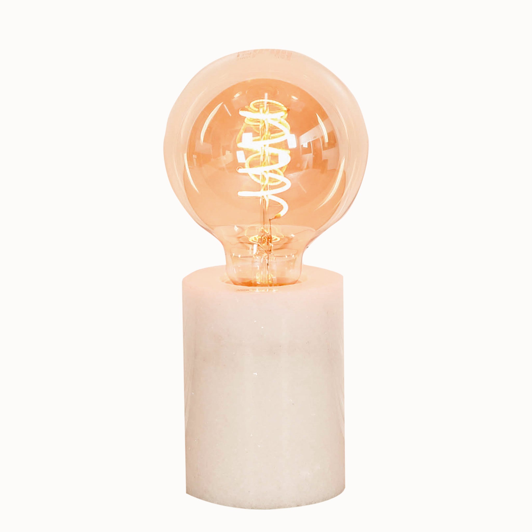 Front view of the Amélie Industrial White Marble Table Lamp with Braided Cord showcasing the cylindrical white marble base and exposed warm Edison filament bulb in a minimalist industrial design.