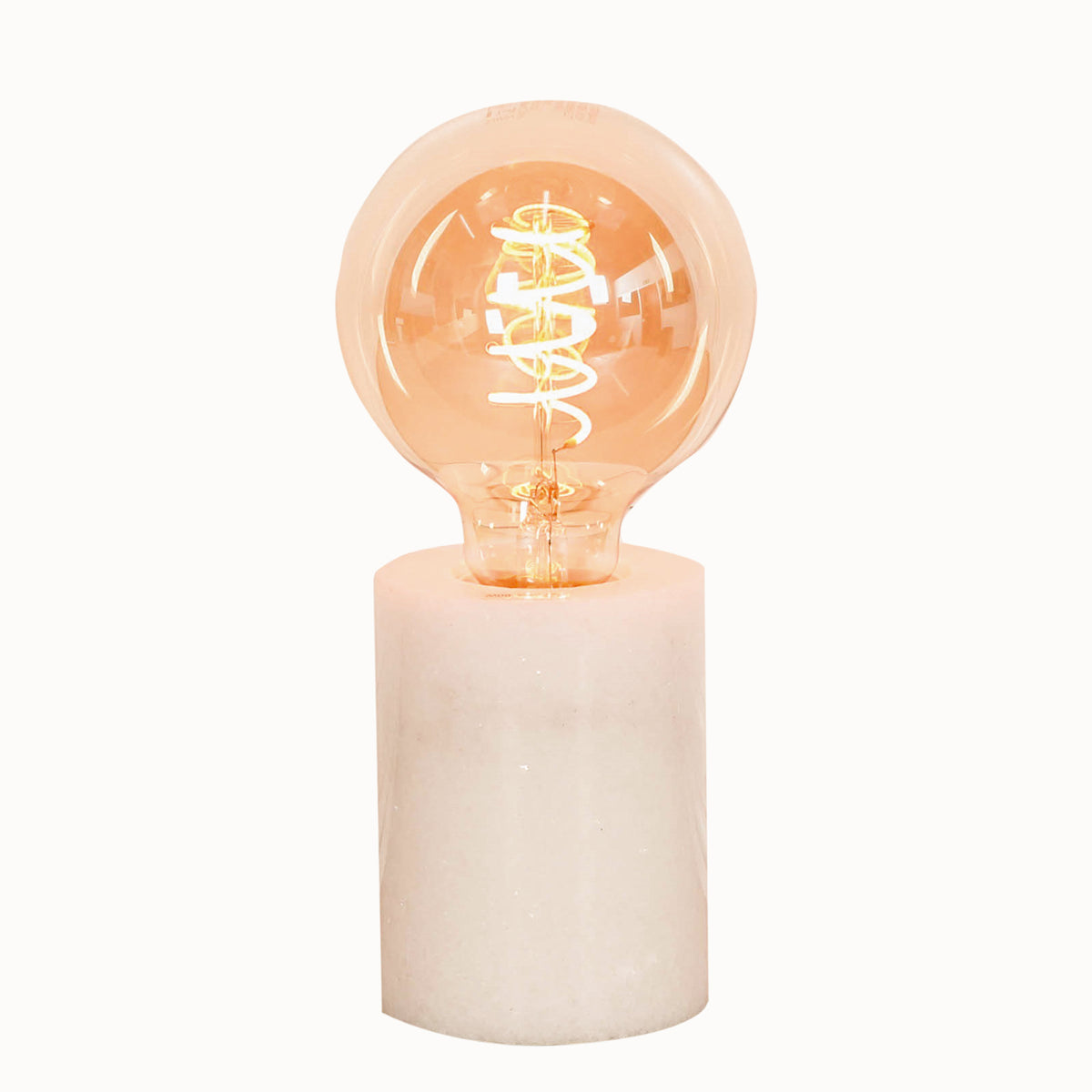 Front view of the Amélie Industrial White Marble Table Lamp with Braided Cord showcasing the cylindrical white marble base and exposed warm Edison filament bulb in a minimalist industrial design.