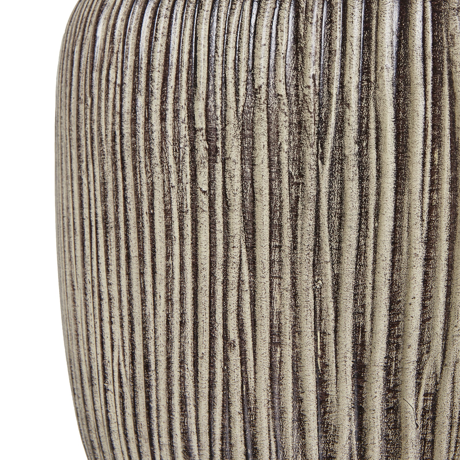 Close-up of Amélie ochre resin table lamp showing its carved ribbed texture against a white background.