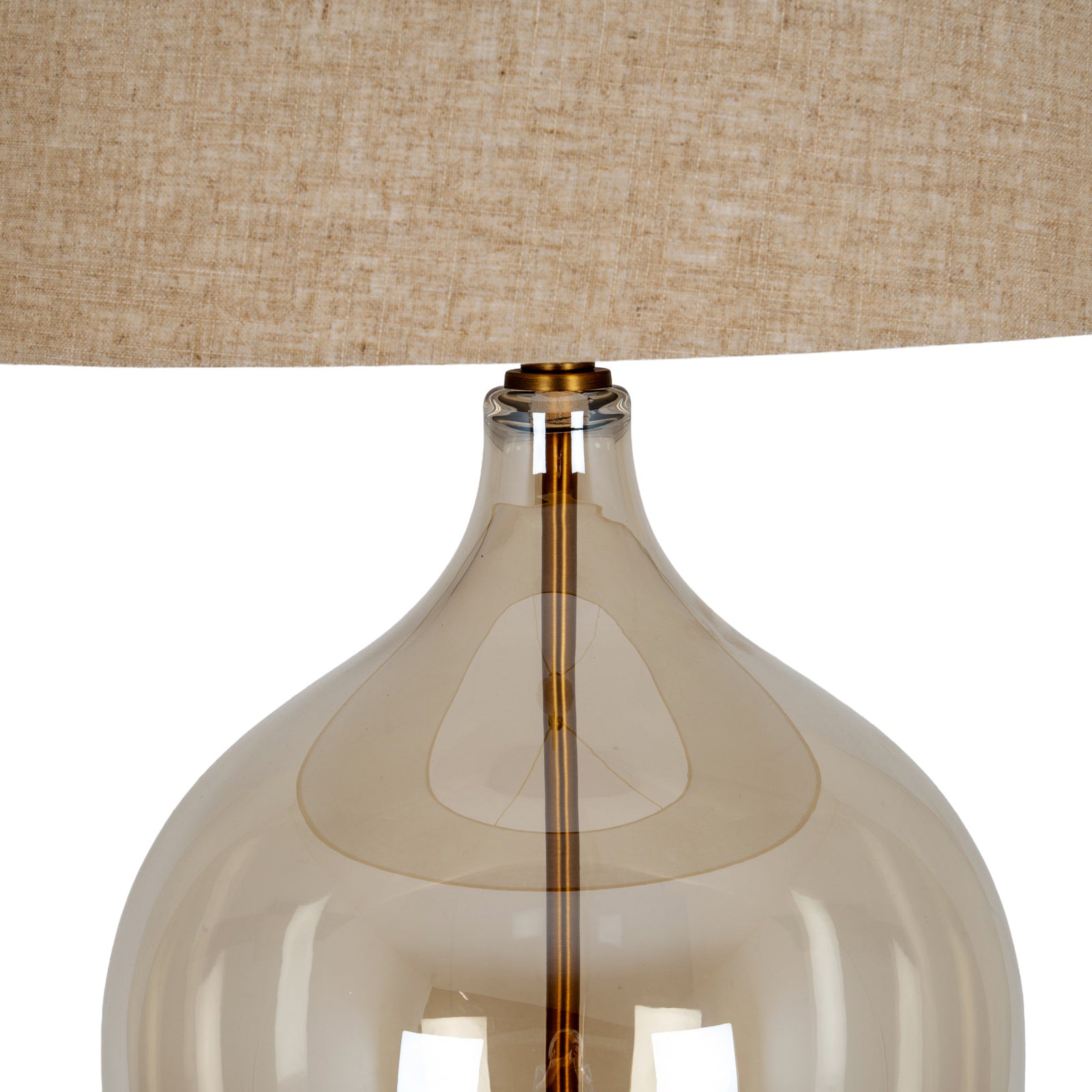 Close-up of Amélie opaline glass table lamp showing glass neck, brass stem and linen shade on white.