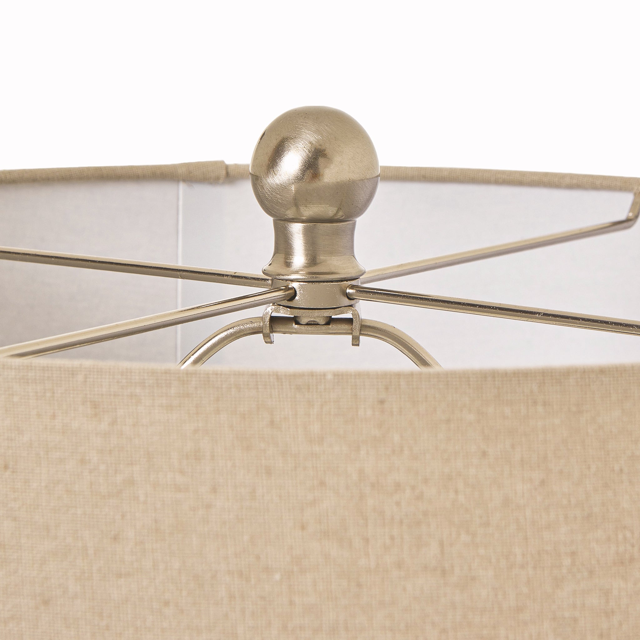 Close-up of the linen drum shade and brushed metal finial on the Amélie White Beaded Ceramic Table Lamp with Linen Shade, highlighting the premium lamp fitting, neutral linen fabric and quality craftsmanship.
