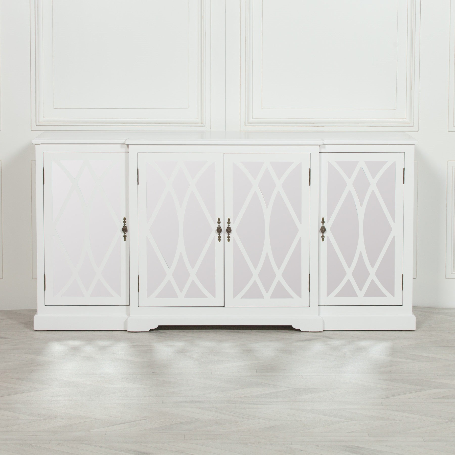 Front view of the Anaïs White Mirrored Four Door Breakfront Sideboard showcasing four mirrored lattice glass cabinet doors, white painted finish, breakfront silhouette and timeless storage cabinet design.
