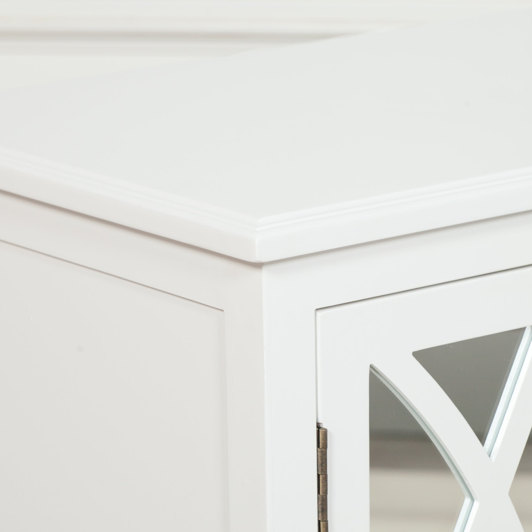 Close-up of the Anaïs White Mirrored Four Door Breakfront Sideboard highlighting the mirrored lattice glass cabinet door, white painted wood frame, premium craftsmanship and elegant breakfront profile.