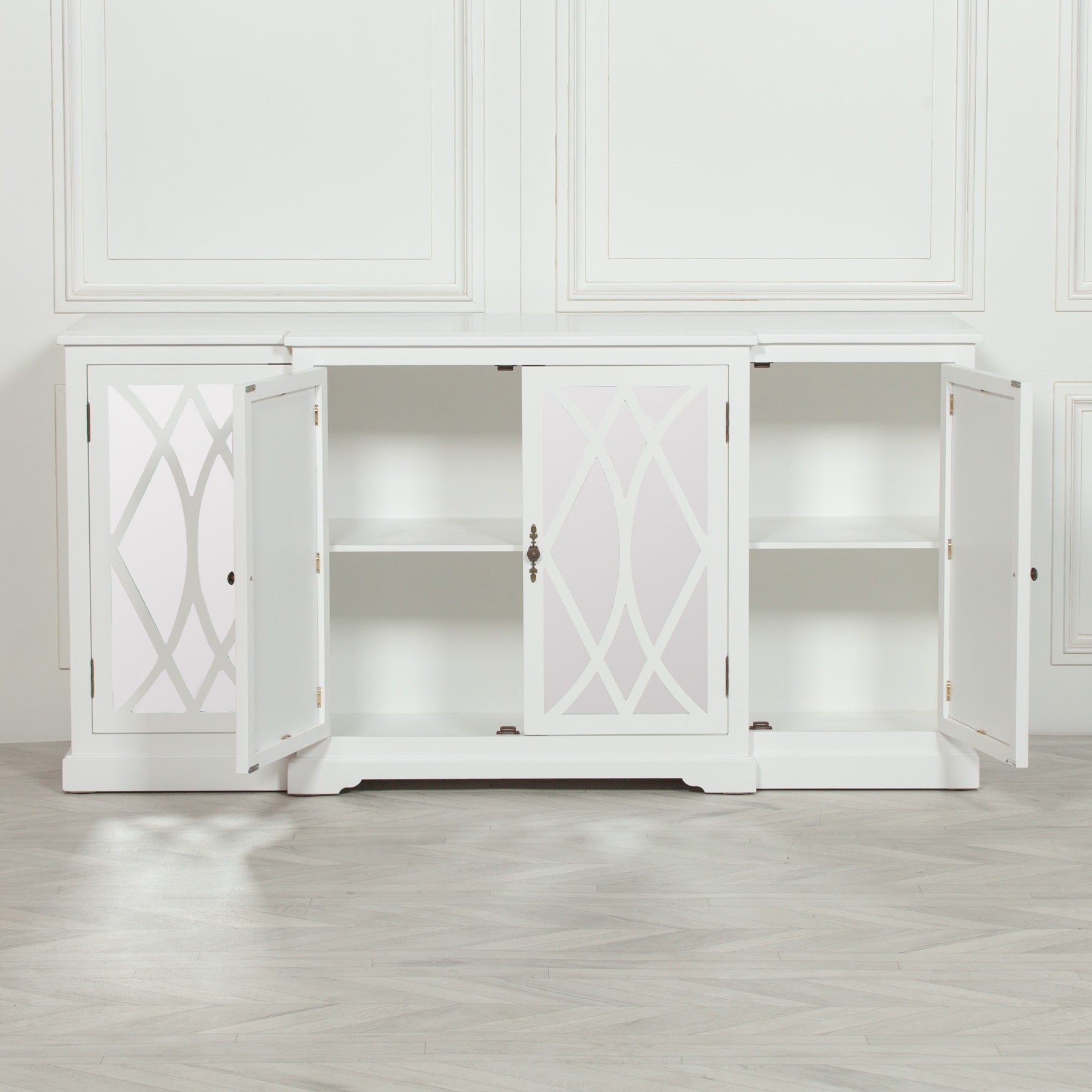 Anaïs White Mirrored Four Door Breakfront Sideboard with all cabinet doors open, revealing spacious internal shelving and versatile concealed storage behind mirrored lattice glass doors.