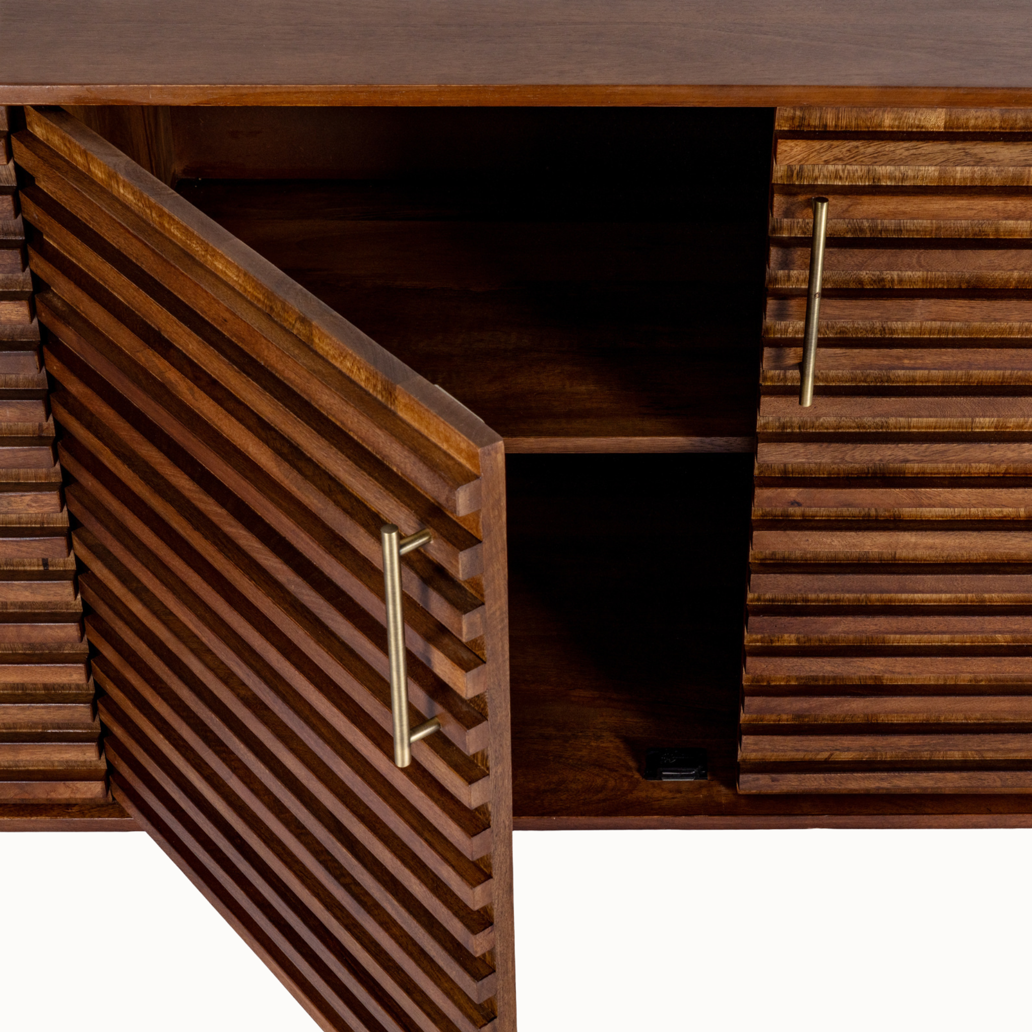 Close-up of Arsène ribbed brown wood sideboard with door open, showing storage shelves and gold handle on white.