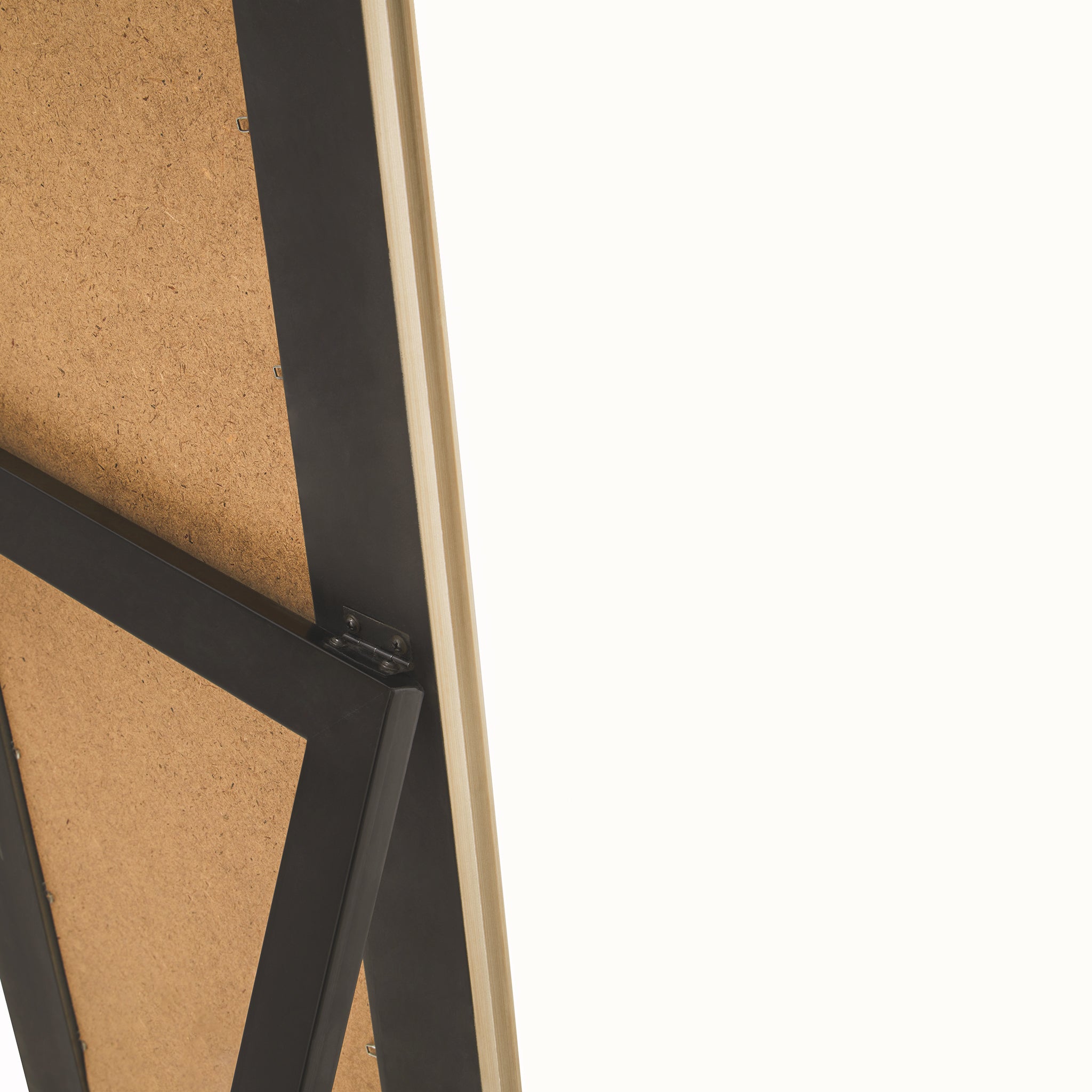 Rear close-up of the Aurelia freestanding floor mirror showing the back panel, champagne-coloured frame edge, black easel support and hinge mechanism used to support the full-length mirror.