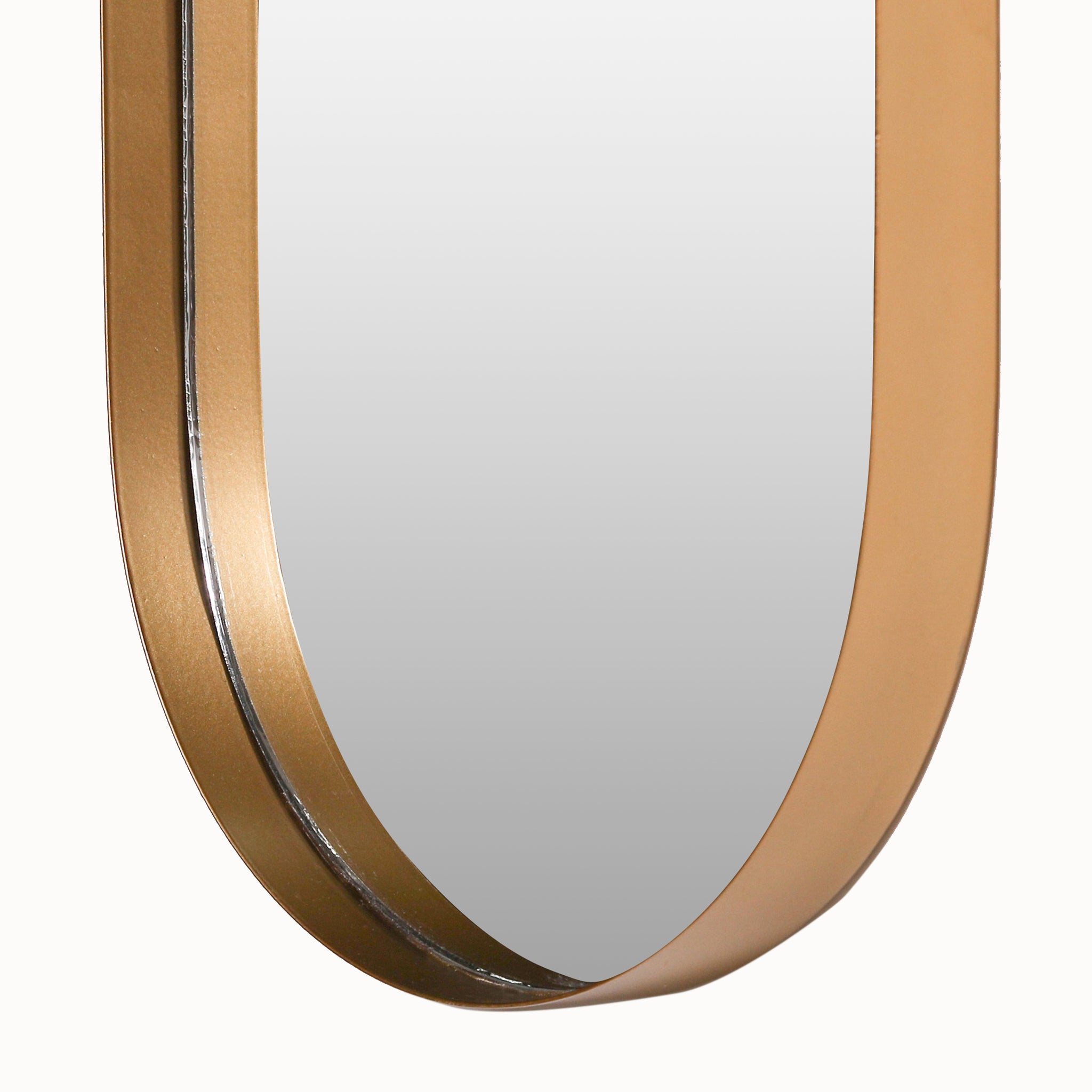 Close-up of the Aurelia Gold Oval Accent Wall Mirror highlighting the curved lower edge, reflective mirror glass and deep-set gold frame that creates a distinctive dimensional border.