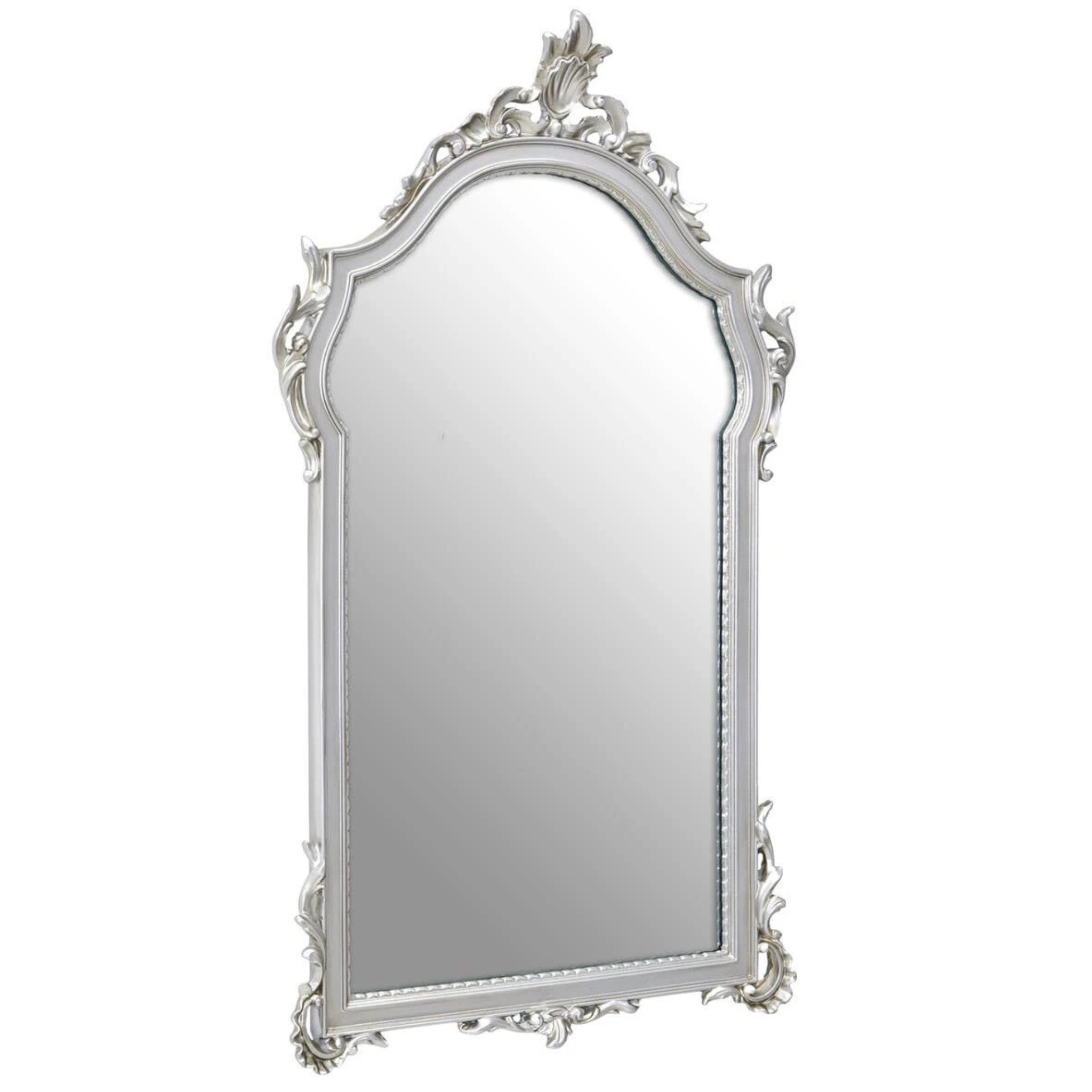 Aurelia ornate silver wall mirror shown at an angle, highlighting the arched frame and sculpted scrollwork on white.