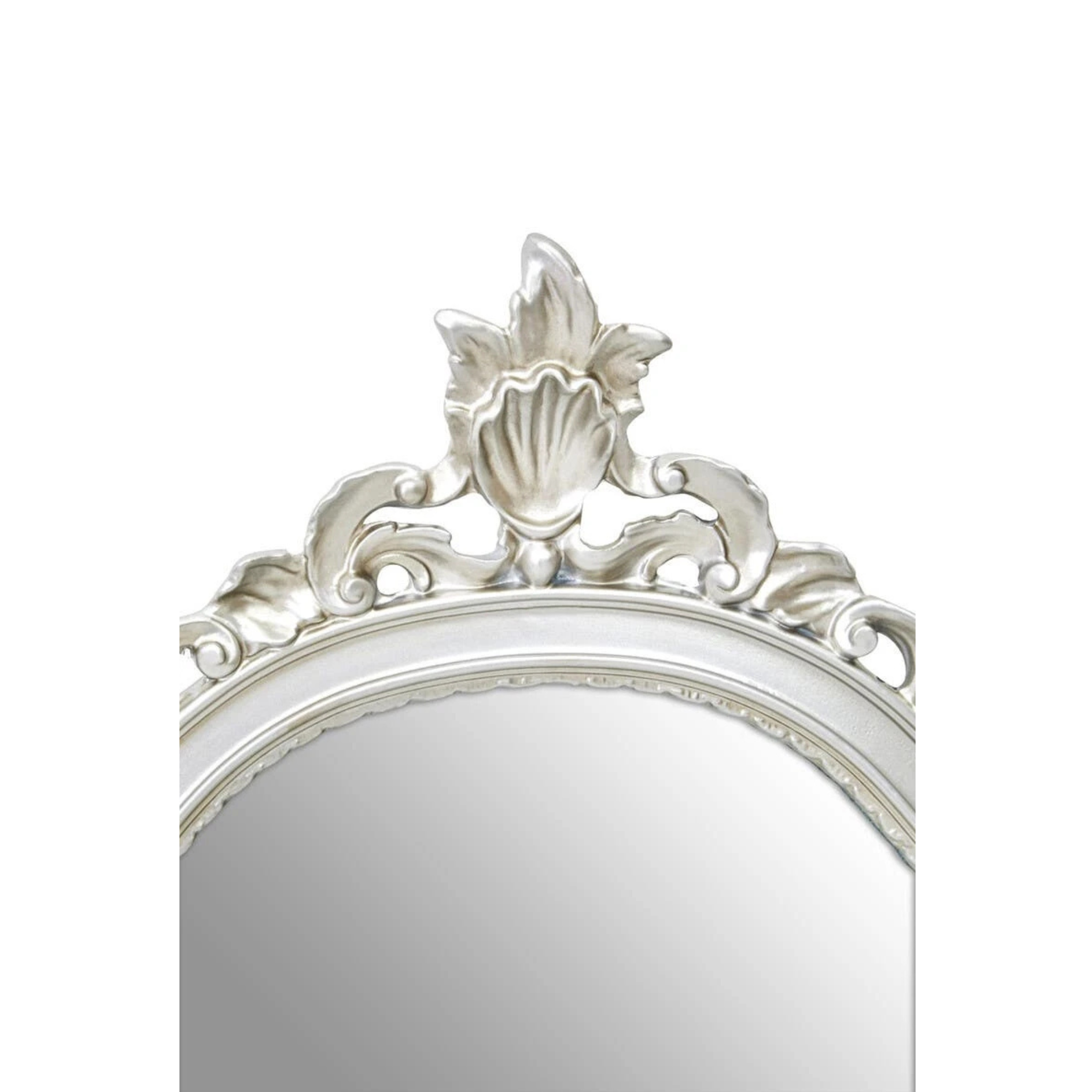 Close-up of Aurelia silver wall mirror crest with carved floral and scroll detailing against a white background.