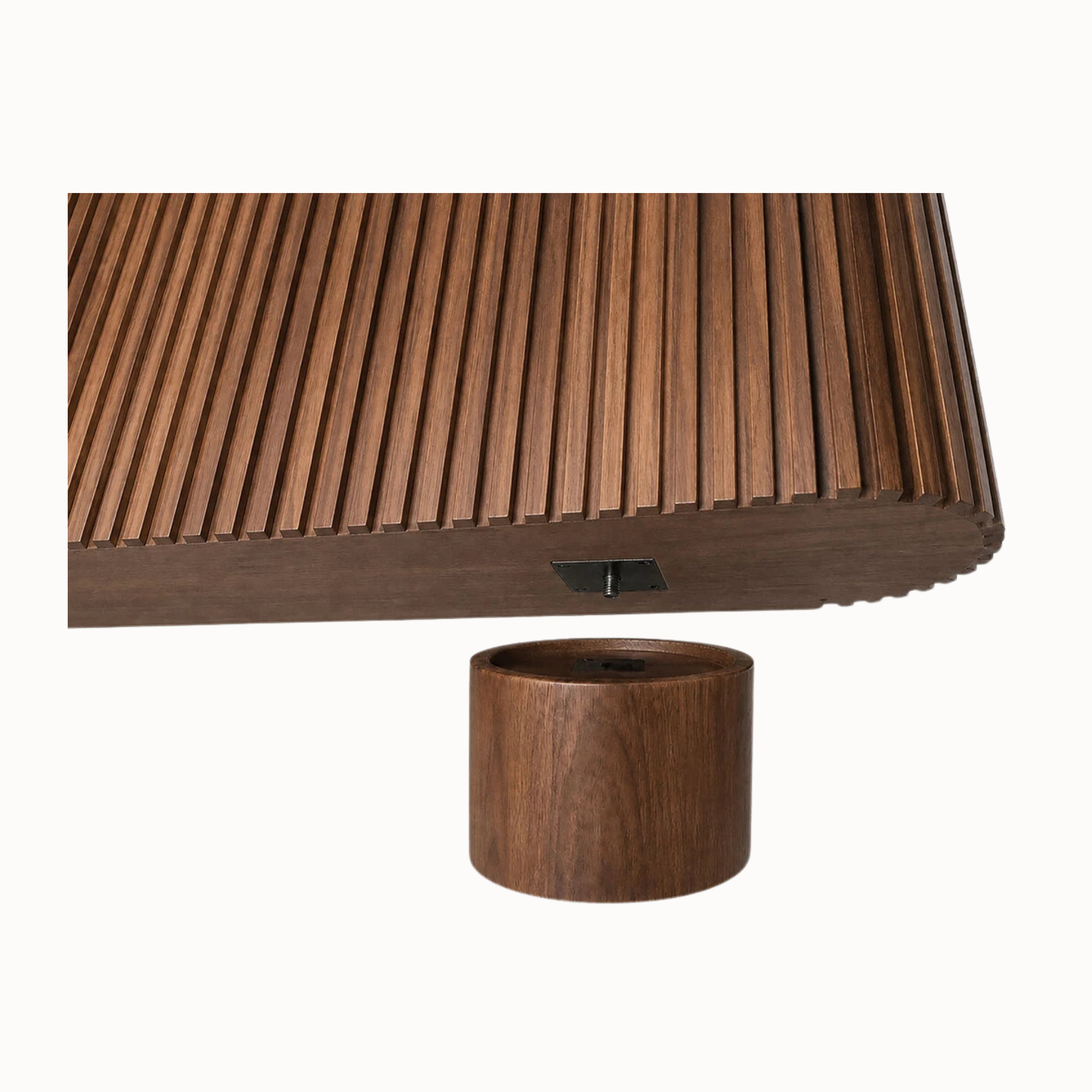 Close-up of fluted mango wood sideboard base and cylindrical pedestal leg fitting against a plain white background.
