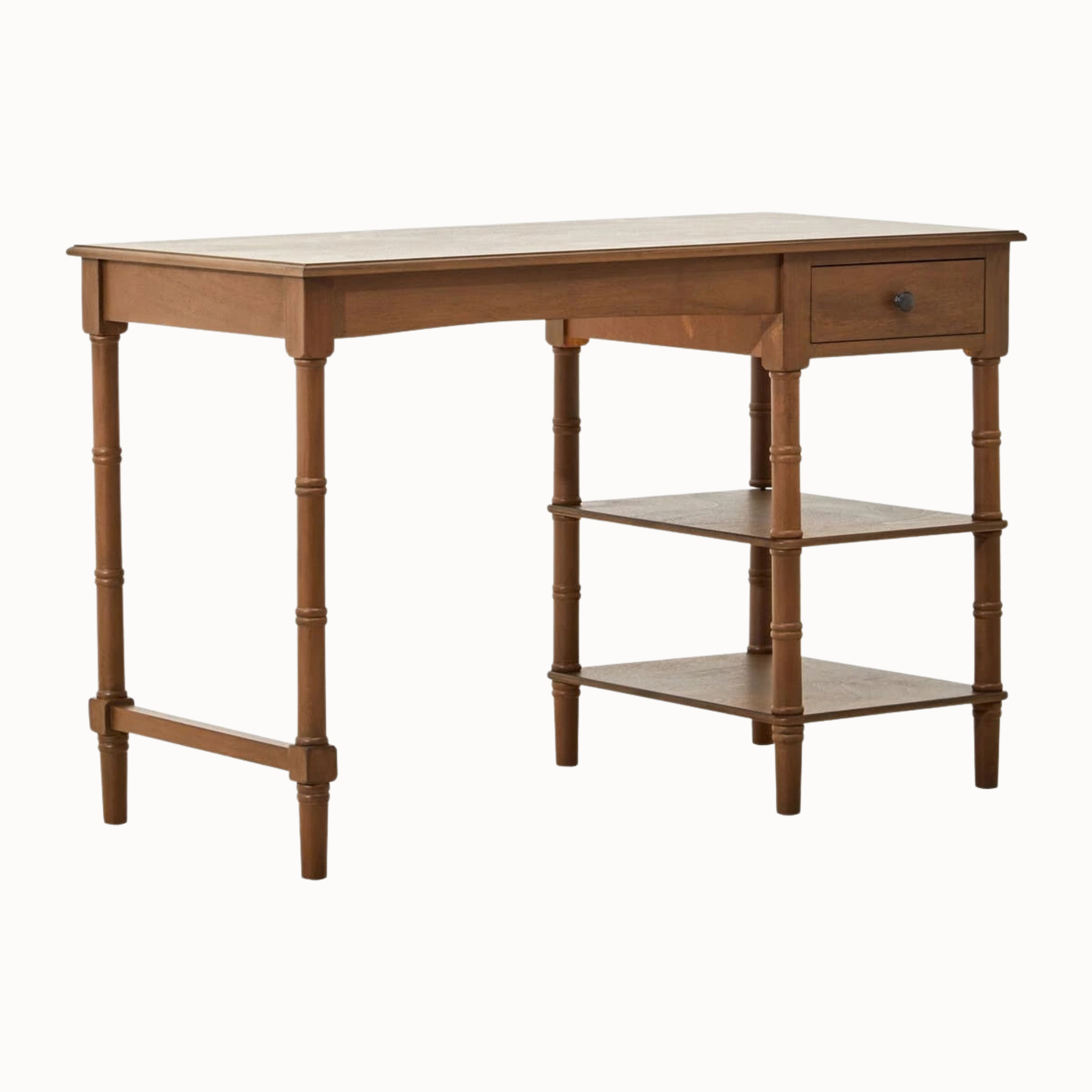 Aveline 116cm brown wood writing desk angled view with open drawer, two storage shelves and turned legs on white.