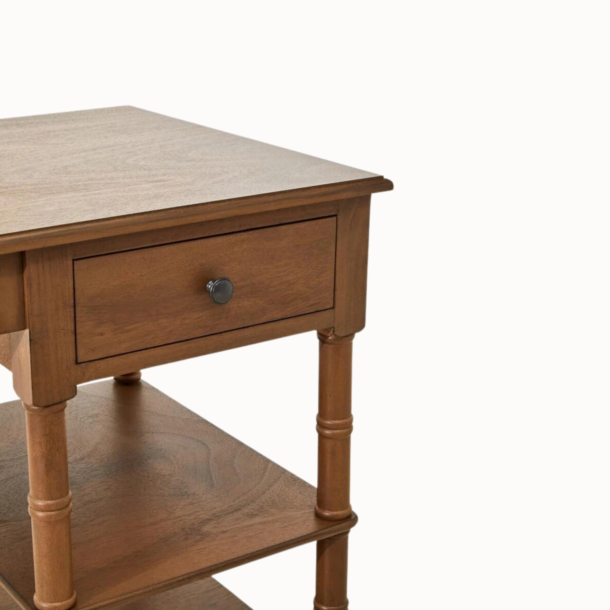 Close-up of Aveline 116cm brown writing desk showing rectangular wooden tabletop, turned legs and side shelves on white.
