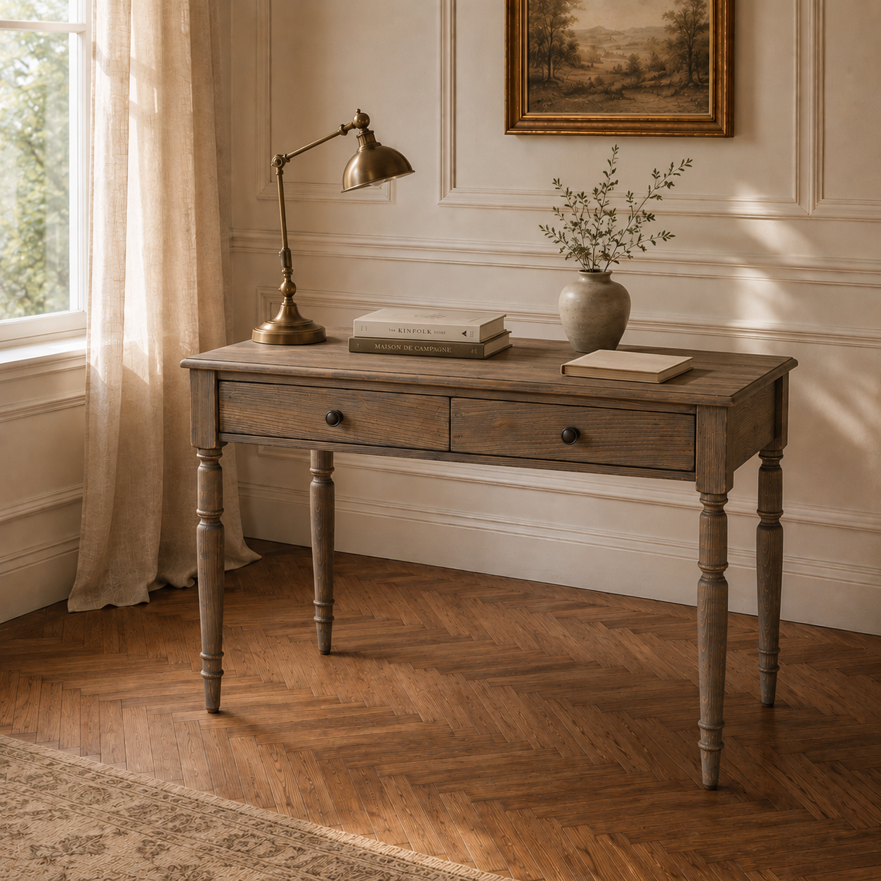 Aveline pine wood writing desk with 2 drawers styled with brass lamp and books in a warm panelled interior