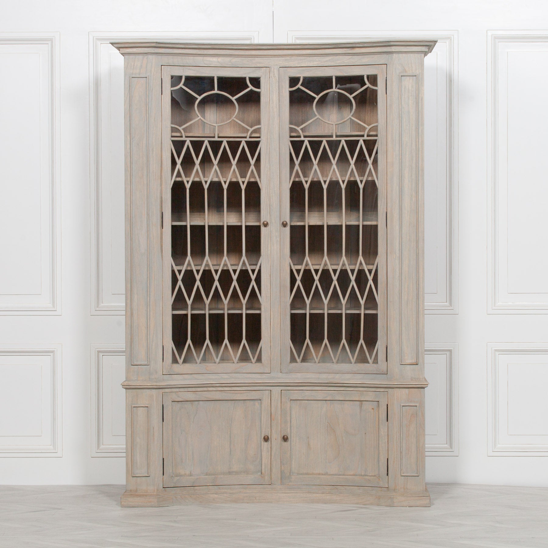 Camille 159cm white cedar display cabinet with decorative glass doors against a white panelled wall.