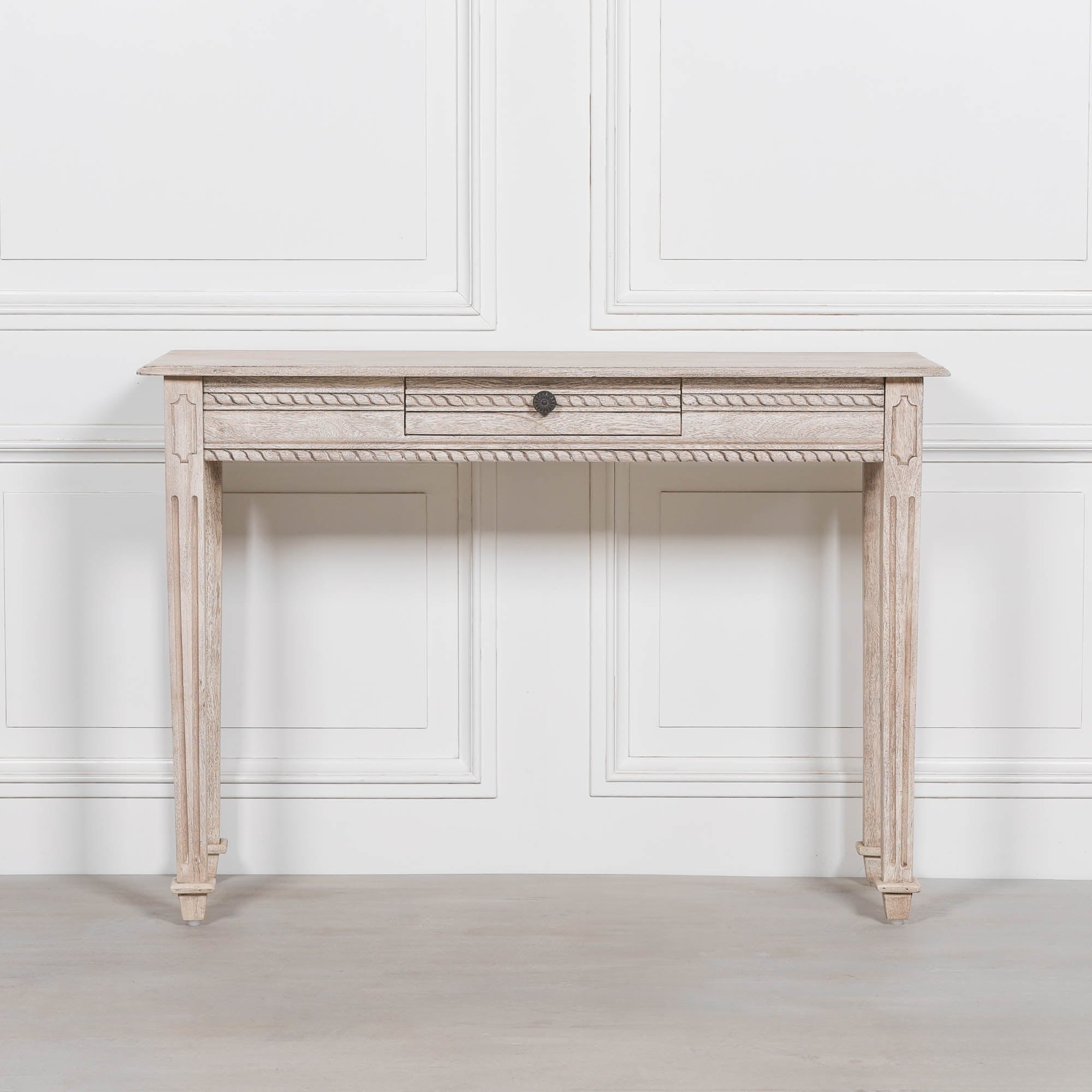 Camille acacia wood dressing table with central drawer and carved rope trim against a white panelled wall