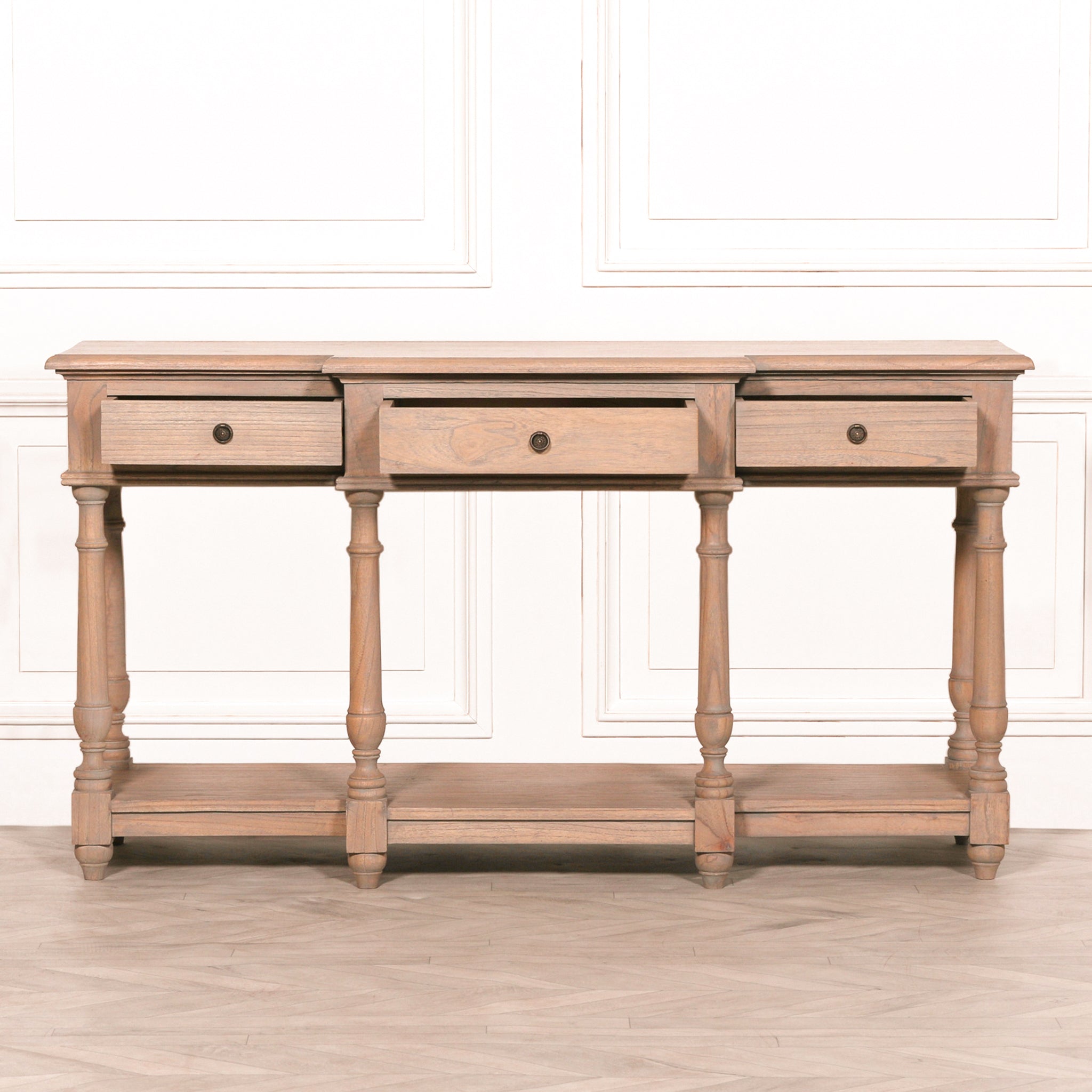 Camille Breakfront white cedar wood console table with all three drawers partially open, highlighting practical storage, rustic craftsmanship, turned legs and full-width lower shelf.