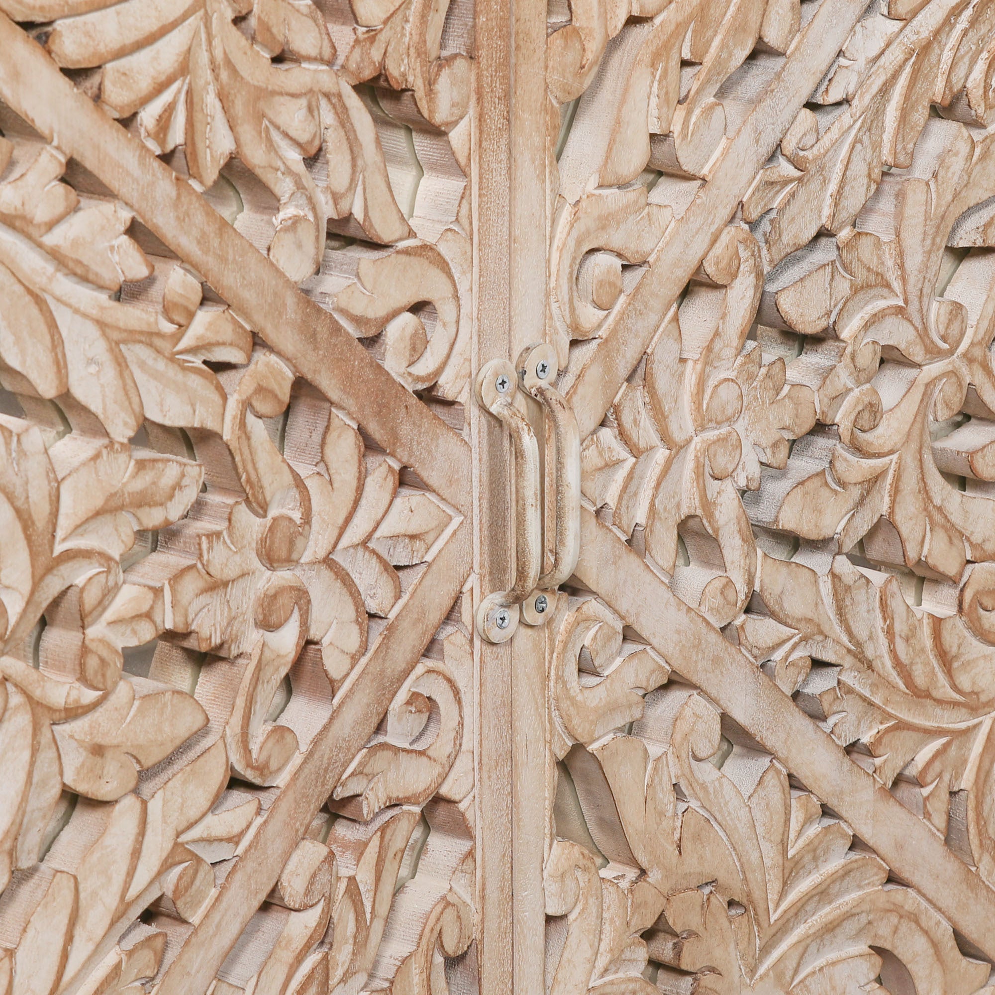 Close-up of the Camille Four Door Carved Mirrored Sideboard highlighting intricate floral hand carved mirrored door panels, artisan woodworking and the natural bleached mango wood finish.