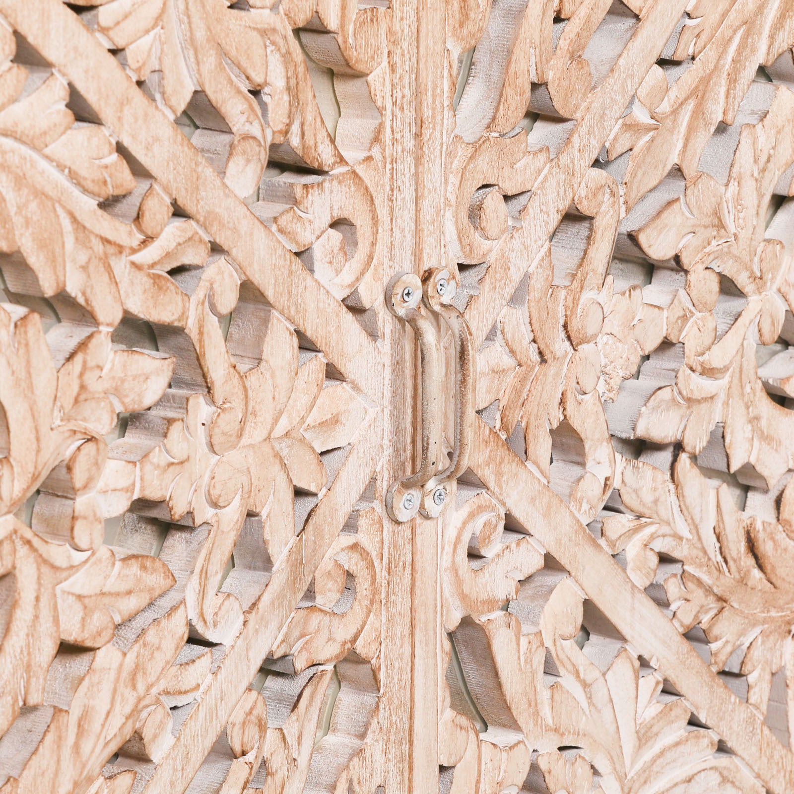 Detailed close-up of the Camille Four Door Carved Mirrored Sideboard featuring ornate floral hand carved mirrored door panels, intricate artisan woodwork and natural bleached mango wood.