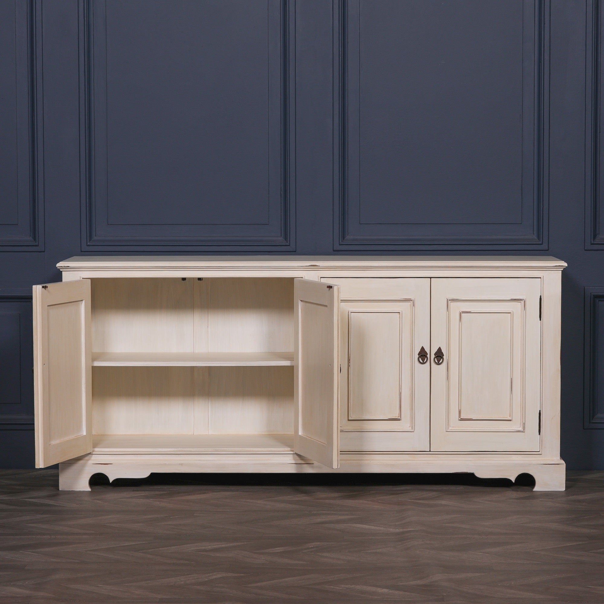 Camille Four Door Classical Sideboard with cupboard doors open revealing spacious internal shelving for dining room storage, living room organisation, tableware, linens and household essentials.