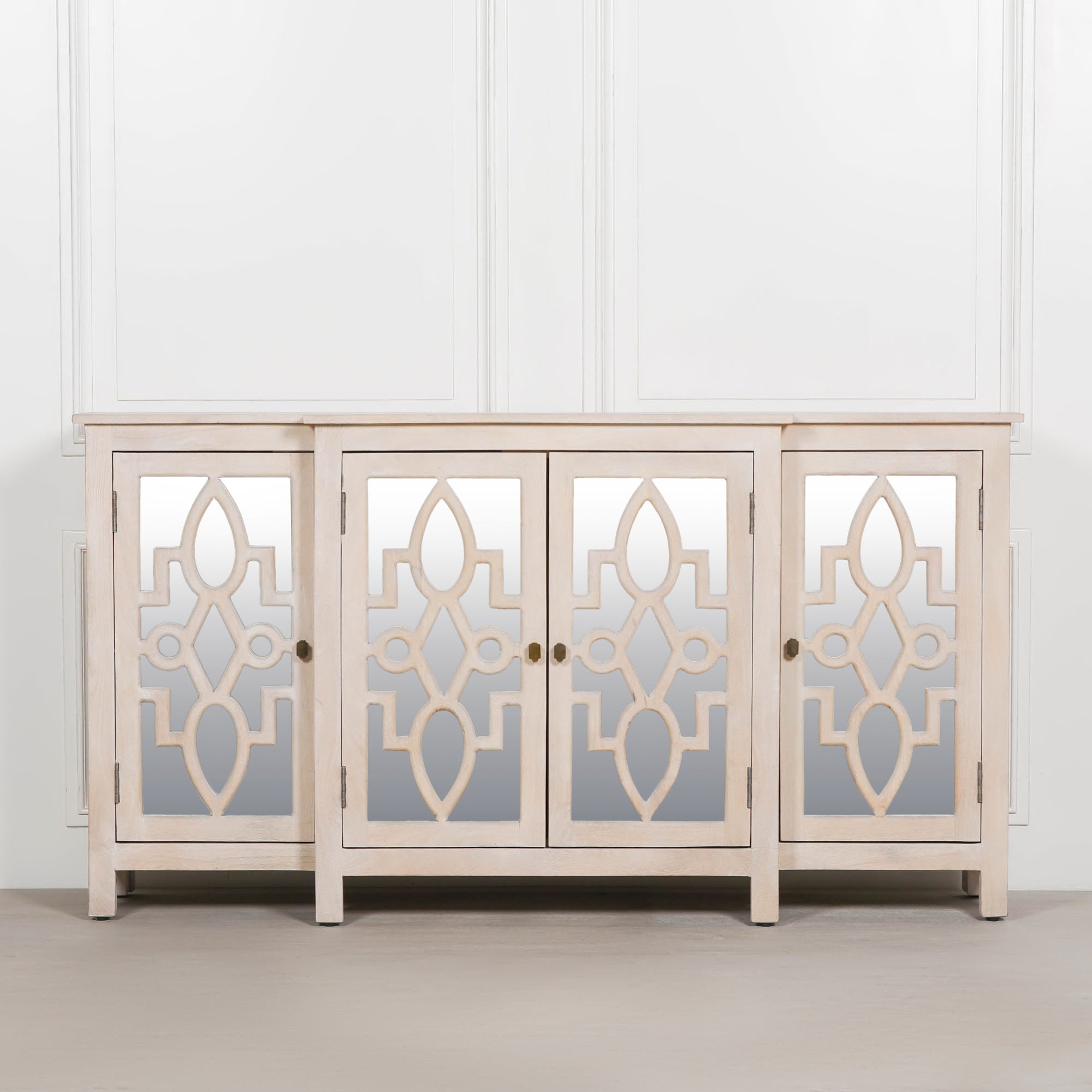 Front view of the Camille Four Door Mirrored Sideboard in bleached mango wood featuring four mirrored cabinet doors, handcrafted wooden frame and generous storage for living or dining rooms.