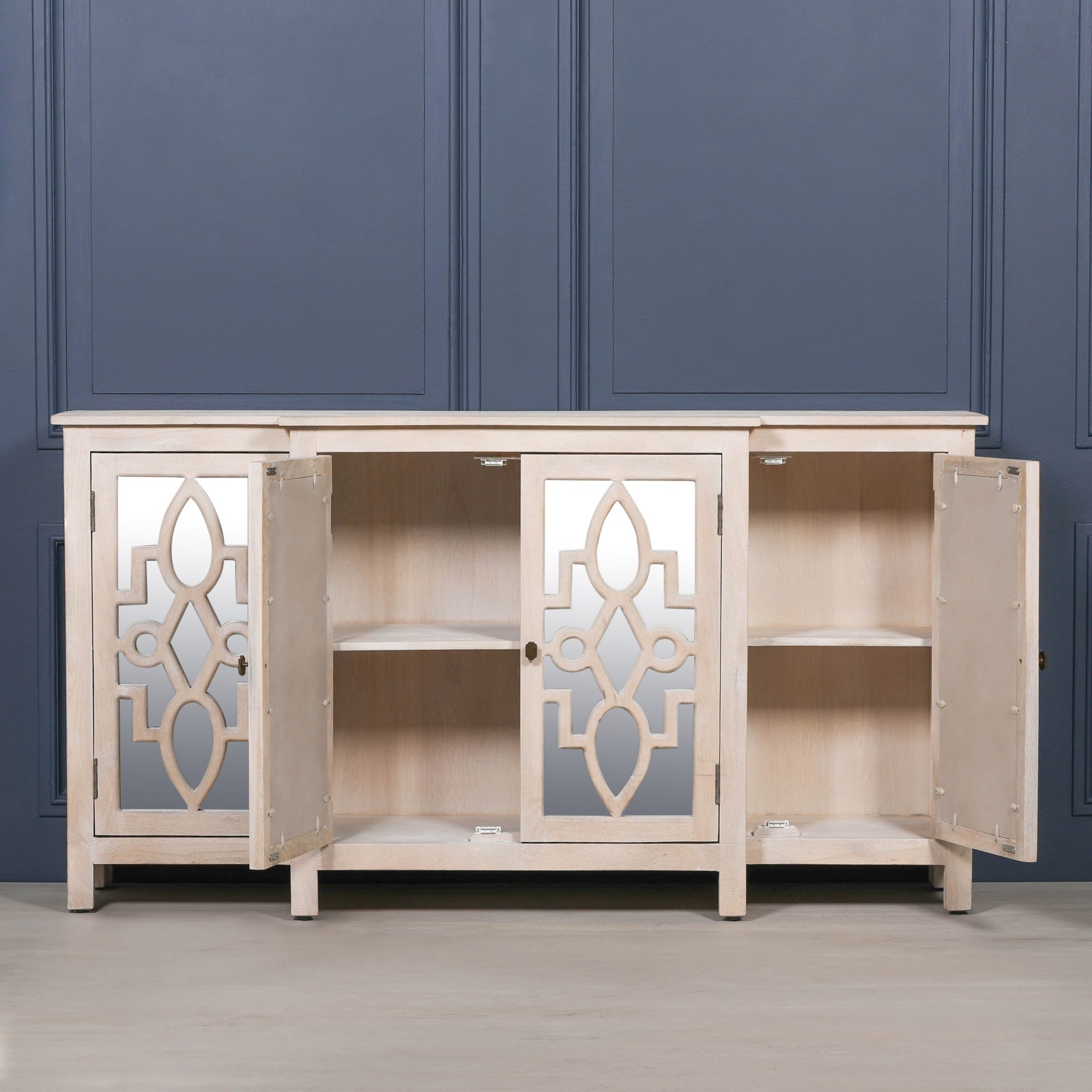 Camille Four Door Mirrored Sideboard with cabinet doors open revealing spacious storage shelves, mirrored doors and versatile organisation for dining room essentials and household storage.
