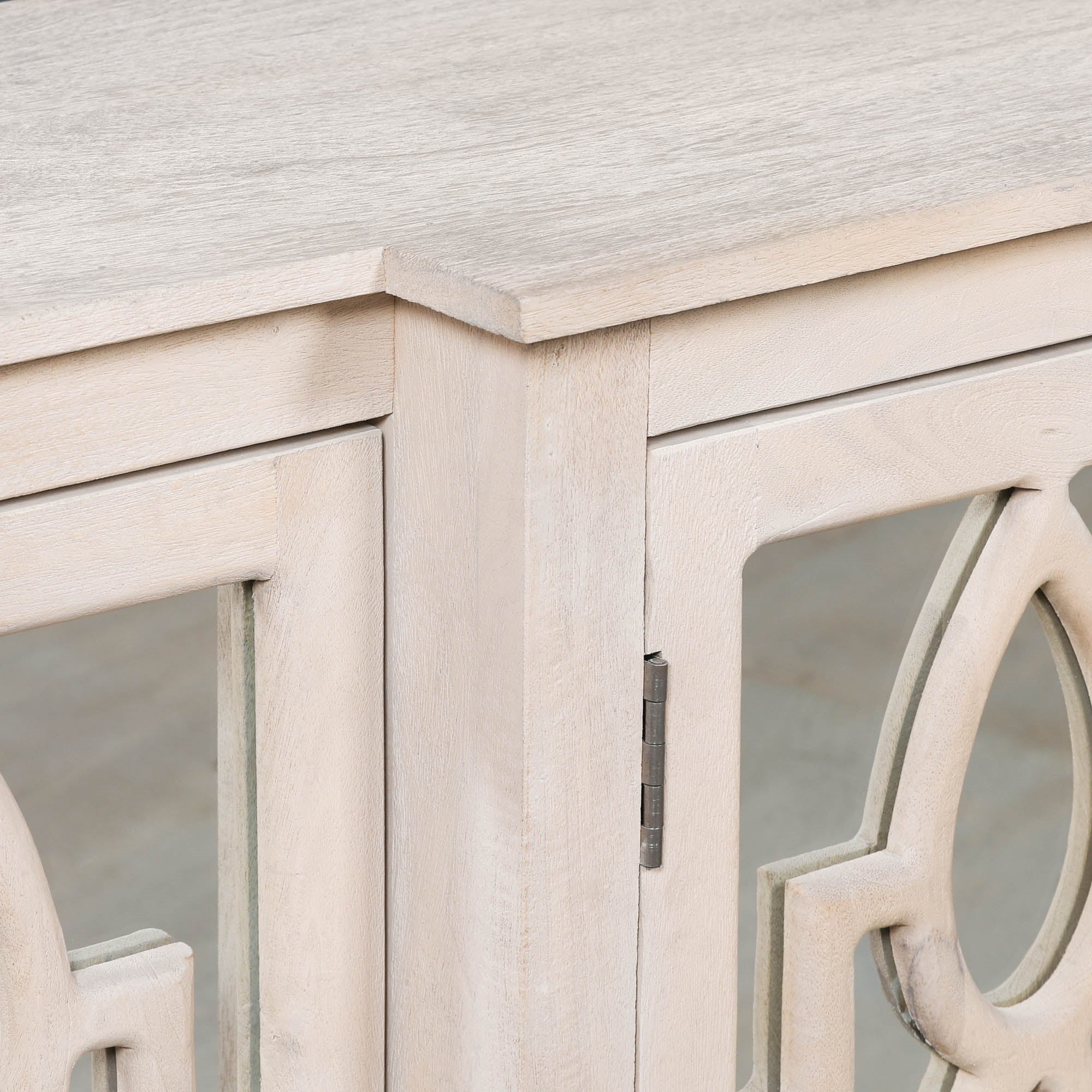 Detailed view of the Camille Four Door Mirrored Sideboard showing the solid bleached mango wood top, handcrafted cabinet frame and premium mirrored door detailing.