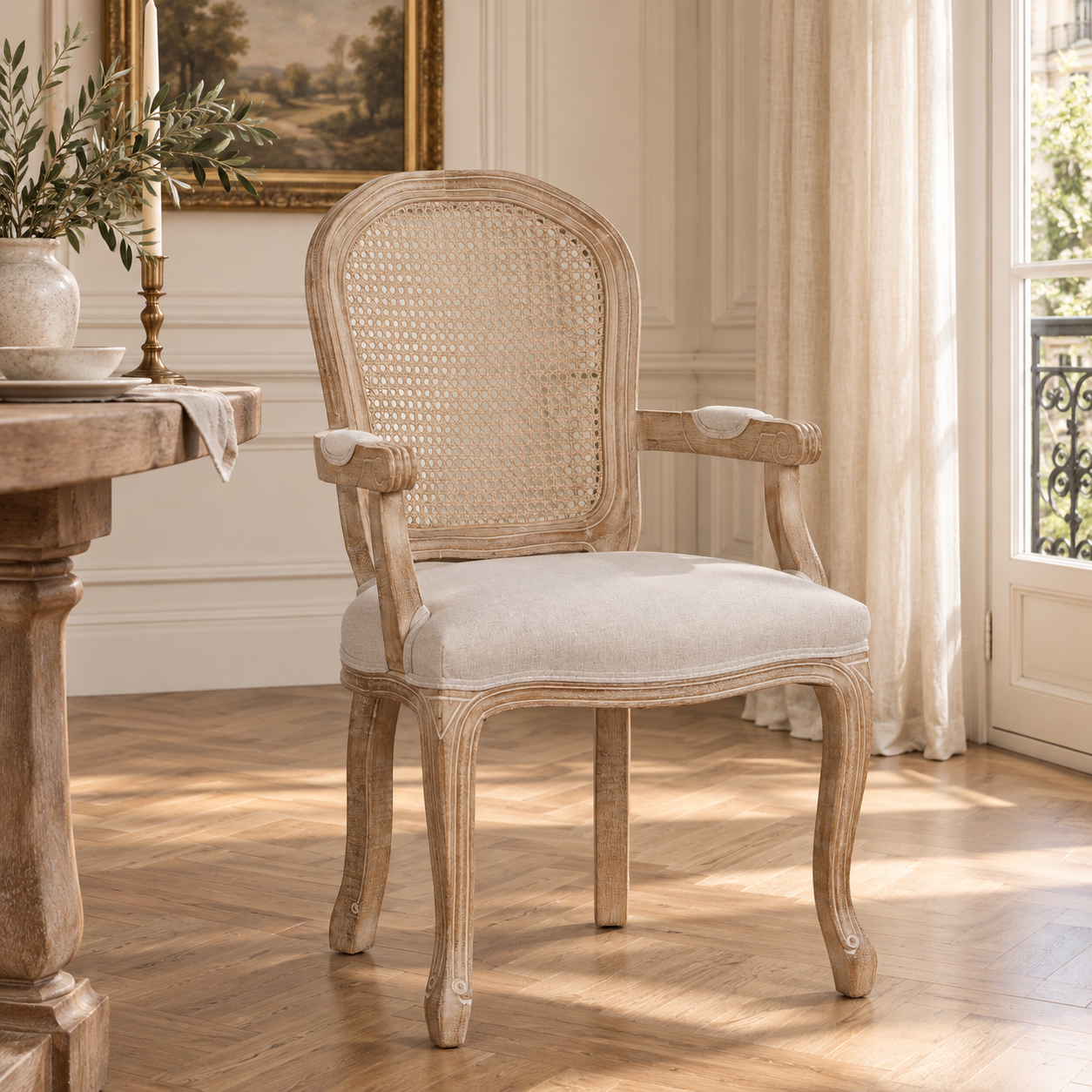 Camille French Louis cane back dining armchair with linen seat in a sunlit Parisian room with wood flooring