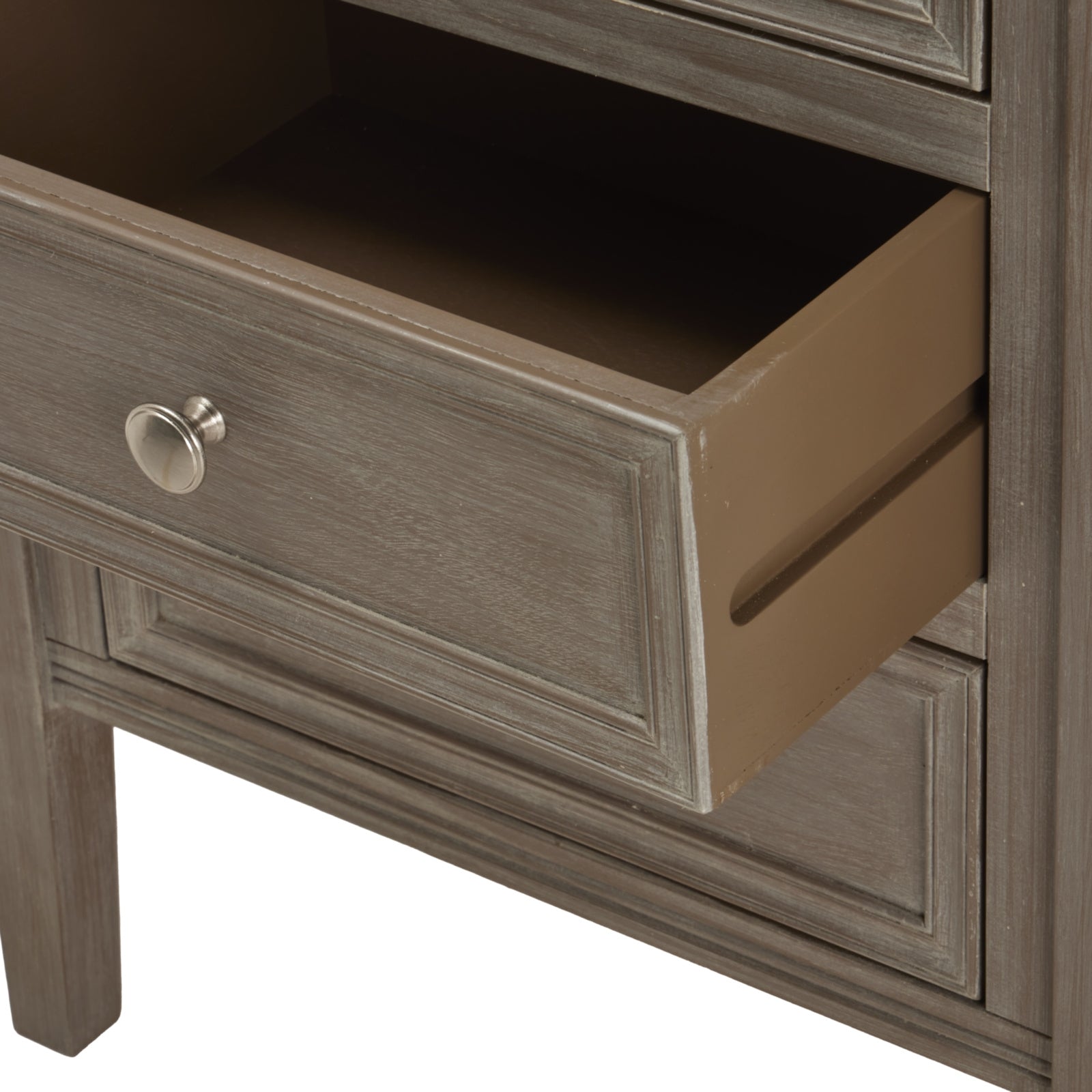 Open drawer detail on grey wooden bedside table with framed drawer front and silver knob against a white background.