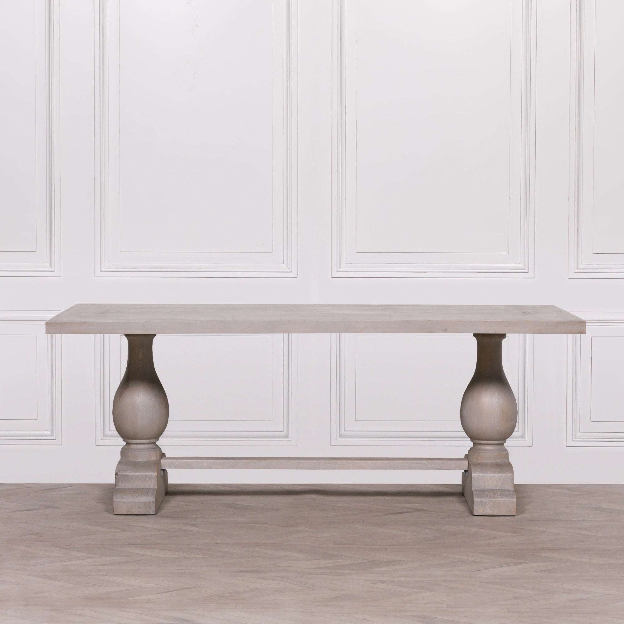 Front view of the Camille Large Rectangular Dining Table 210cm for 8–10 in Bleached Mango Wood highlighting the generous solid wood tabletop, twin turned pedestal legs, trestle stretcher base and handcrafted natural finish for contemporary dining room interiors.