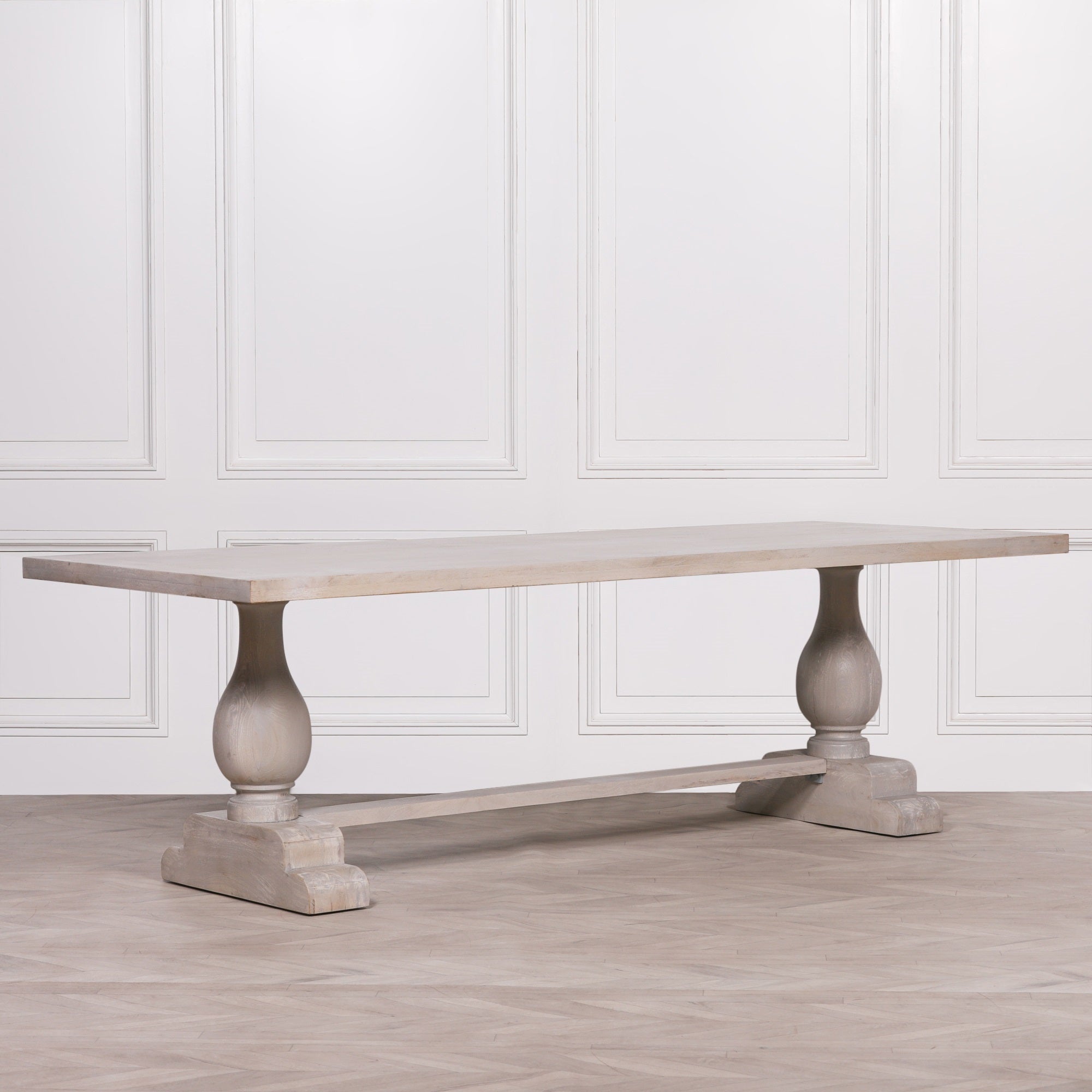 Side view of the Camille Large Rectangular Dining Table 260cm for 10–12 in Bleached Mango Wood showcasing the expansive solid wood tabletop, elegant double pedestal trestle base and generous proportions designed for large family dining and entertaining.