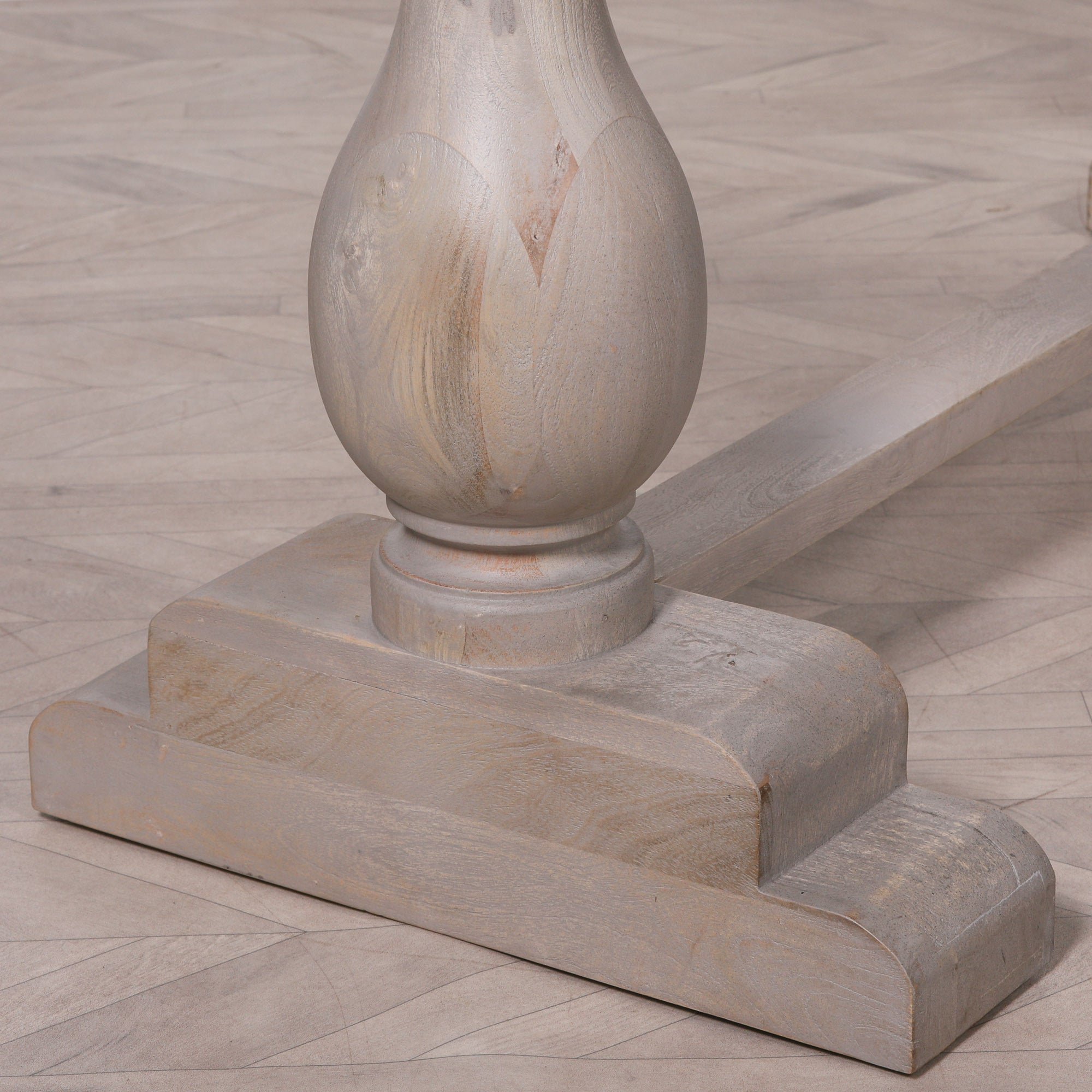 Detailed close-up of the Camille Large Rectangular Dining Table 260cm for 10–12 featuring the sculptural turned pedestal leg, solid trestle stretcher and handcrafted Bleached Mango Wood construction for exceptional durability and timeless style.