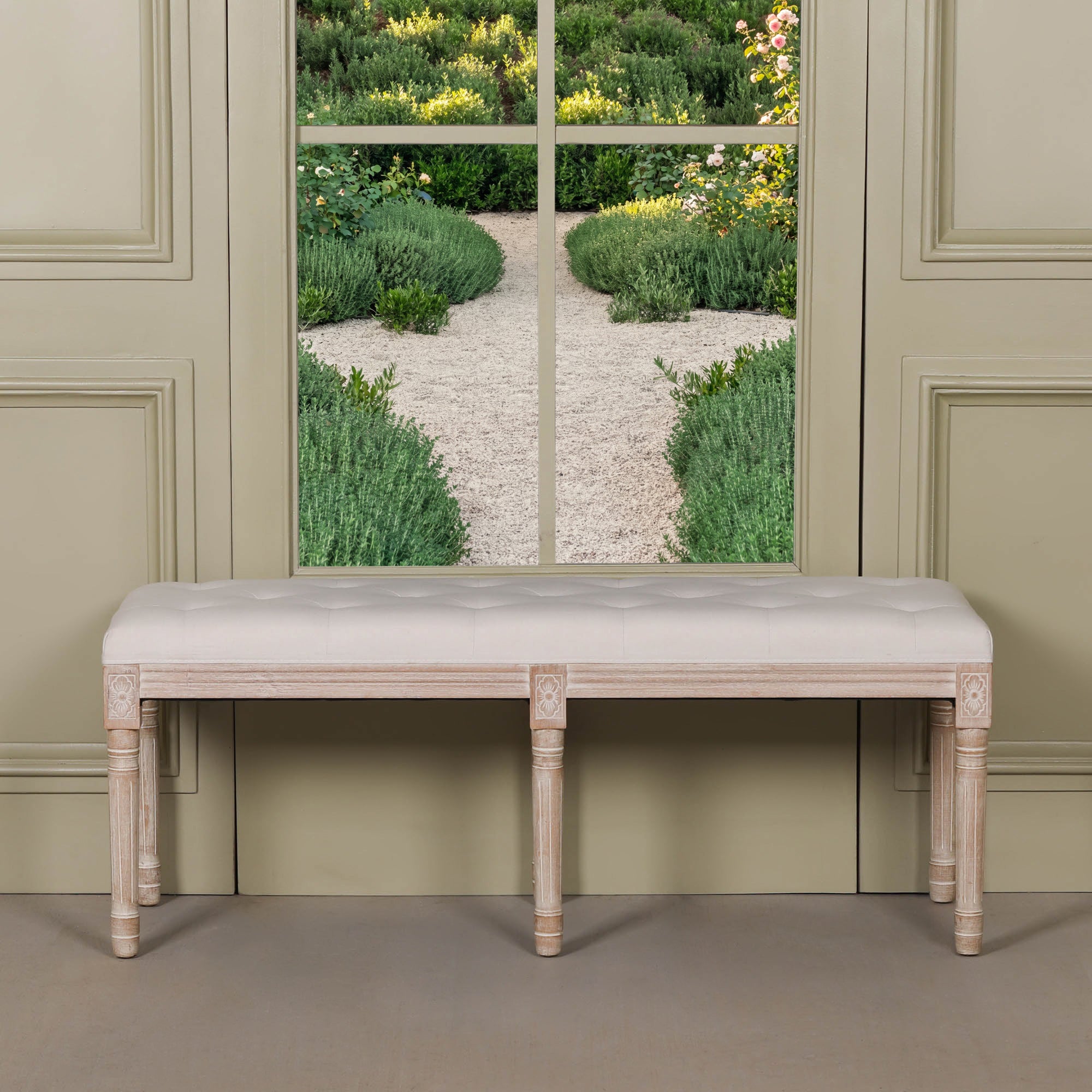 Front view of the Camille Louis Upholstered Bench with a beige button tufted linen seat and washed birch wood frame, showcasing elegant French country craftsmanship in a luxury bedroom or hallway setting.