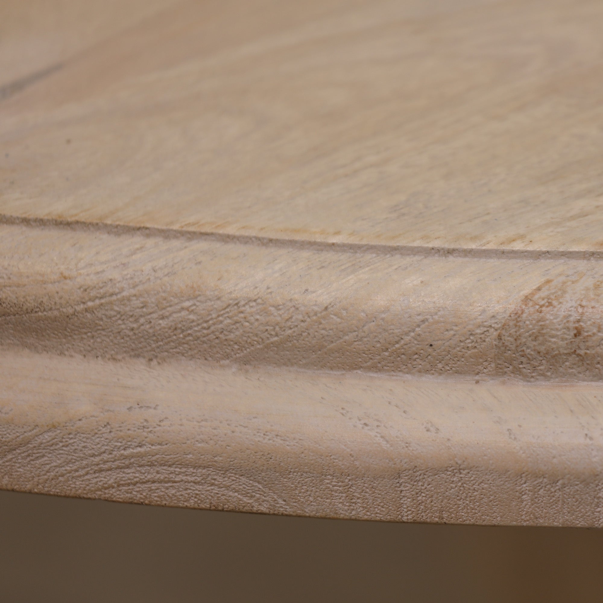 Close-up of the Camille Round Pedestal Dining Table 152cm for 6 highlighting the rounded tabletop edge, natural Bleached Mango Wood grain, handcrafted finish and premium solid wood construction for timeless dining room furniture.